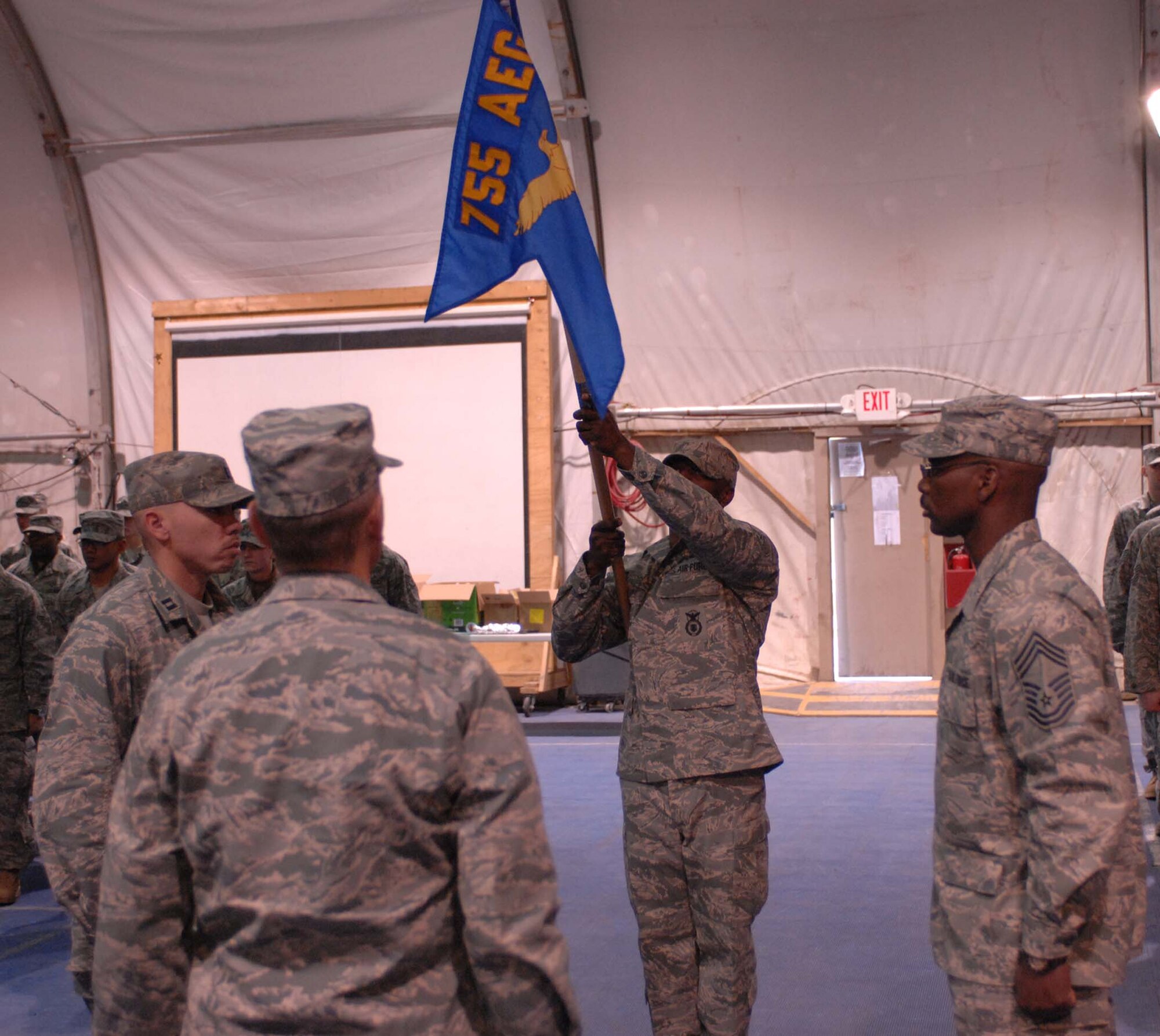 BAGRAM AIR BASE, Afghanistan – The 755th Expeditionary Security Forces Squadron guidon is presented for the last time here Jan. 11, 2008.  The squadron, originally formed in December 2005 in response to a U.S. Army request for support of its detainee operations mission, was inactivated during a formal ceremony here today. (U.S. Air Force photo by Staff Sgt. Mike Andriacco)