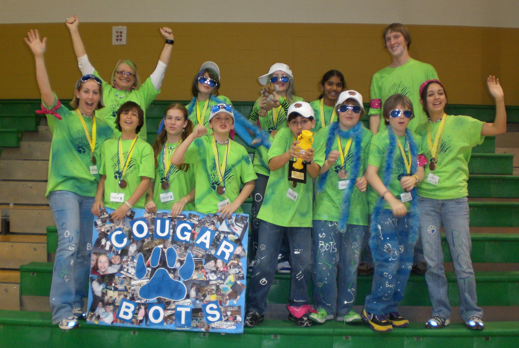 Members of the Cougar Bots team from Canton Country Day School, Canton, Ohio, celebrate following their performance at the FIRST LEGO League Ohio State Robotics Championship.  The 2008 event, co-sponsored by the Wright-Patterson Air Force Base Educational Outreach Office, brought together 48 teams of students and mentors from across the state to demonstrate their knowledge of environmental issues.  The competition was held Jan. 12-13 at Wright State University.  The Cougar Bots team took Dependable Design Award honors.   (U.S. Air Force photo/Derek Kaufman)
