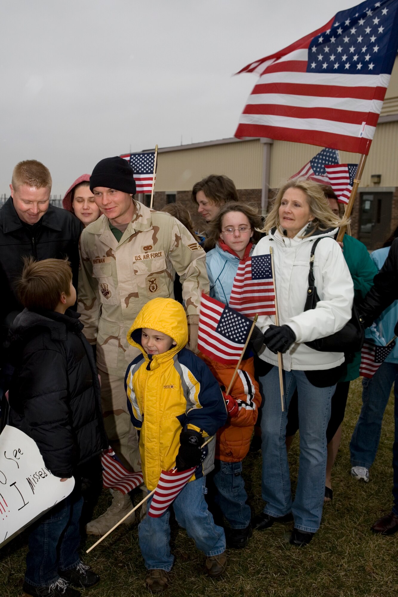 GRISSOM AIR RESERVE BASE, Ind.  -- Friends and family members of Senior Airman Luke Whitman, 434th Security Forces Squadron, welcome him home Jan. 13. Airman Whitman and three other security members were greeted upon their return following a six-month deployment. The group provided air base ground defense security to forces stationed at Kirkuk, Air Base, in Iraq. (U.S. Air Force photo/Senior Airman Omar Delacruz)