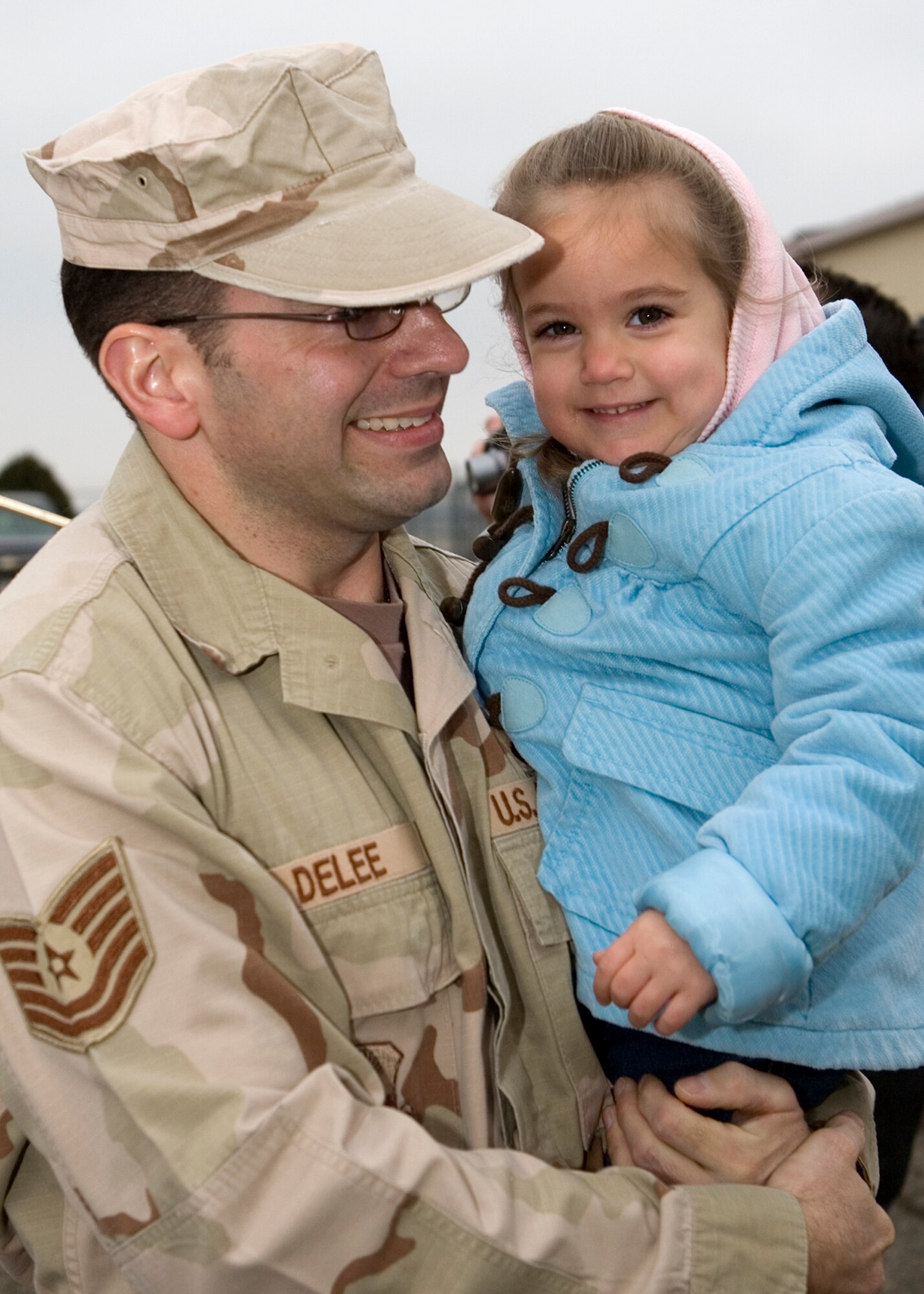 GRISSOM AIR RESERVE BASE, Ind. -- Tech. Sgt. Robert DeLee is all smiles upon his return to Grissom on Jan. 13. Sergeant DeLee and three other members of the 434th Security Forces Squadron returned to the base Sunday following a six-month deployment to Iraq. The group was greeted by family, friends, co-workers and others. While deployed, the group provided air base ground defense security to forces stationed at Kirkuk, Air Base, in Iraq. (U.S. Air Force photo/Senior Airman Omar Delacruz)