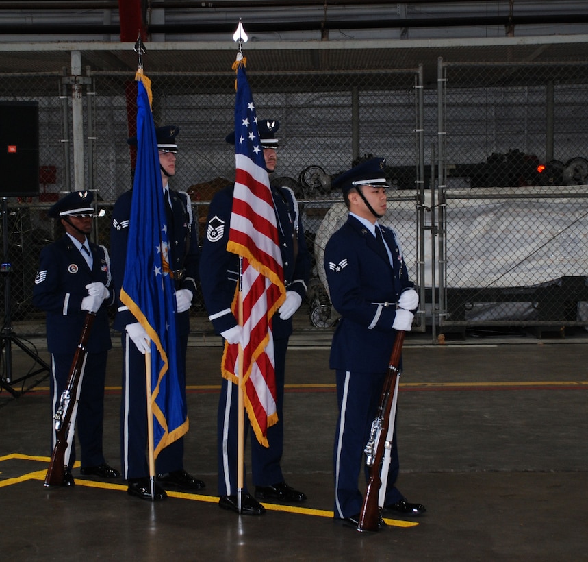 932nd Airlift Wing honor guard members prepare to start the change of command.  
by Tech Sgt. Gerald Sonnenberg
932nd Airlift Wing

1/6/2008 - Scott AFB, Ill. -- Colonel John C. Flournoy, Jr., comes in to lead the 932nd from 22nd Air Force at Dobbins Air Reserve Base, Ga., where he served as director of 22nd Air Force Operations. Twenty-Second Air Force is the largest of three numbered air forces in the Air Force Reserve, and manages more than 25,000 reservists.   The wing honor guard took care of the details involving the two star general's flag and the American flag.

The mission of the 1,000 member 932nd AW is to provide first-class, worldwide, safe, and reliable airlift for distinguished visitors and their staffs on the wing's C-9C and C-40 aircraft for VIP special assignment missions. The wing reports to 4th Air Force at March Air Reserve Base, Calif. Officiating at the ceremony was Maj. Gen. Robert E. Duignan, commander of Air Force Reserve Command's 4th Air Force. 

"Maryanne (Colonel Miller) has done a wonderful job with this mission bringing us out of the past and into the future with this airplane," said General Duignan. "This mission is vitally important to this nation. This is a new mission for the reserves, and she jumped in with both feet." 

About Colonel Flournoy, General Duignan said, "He's had a great career. He comes to you at the 932nd as a very experienced aviator and somebody that understands the mission. I know he'll do a great job." 

Colonel Flournoy's arrival at Scott AFB is a homecoming of sorts. His father was assigned to the southern Illinois base three times. 

"When asked where I'm from, I tell people I was born in Alabama, but I consider Scott AFB my home town," said Colonel Flournoy. 

Throughout those assignments, he attended Scott AFB elementary schools and Mascoutah High School in Mascoutah, Ill., for much of his early life. He graduated from Southern Illinois University at Edwardsville, Ill., where he also graduat