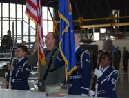932nd Airlift Wing's special honor guard gives special attention to the flags before a recent ceremony welcoming the new commander, Col. John (Jay) C. Flournoy, Jr.  Photo/Tech Sgt. Gerald Sonnenberg