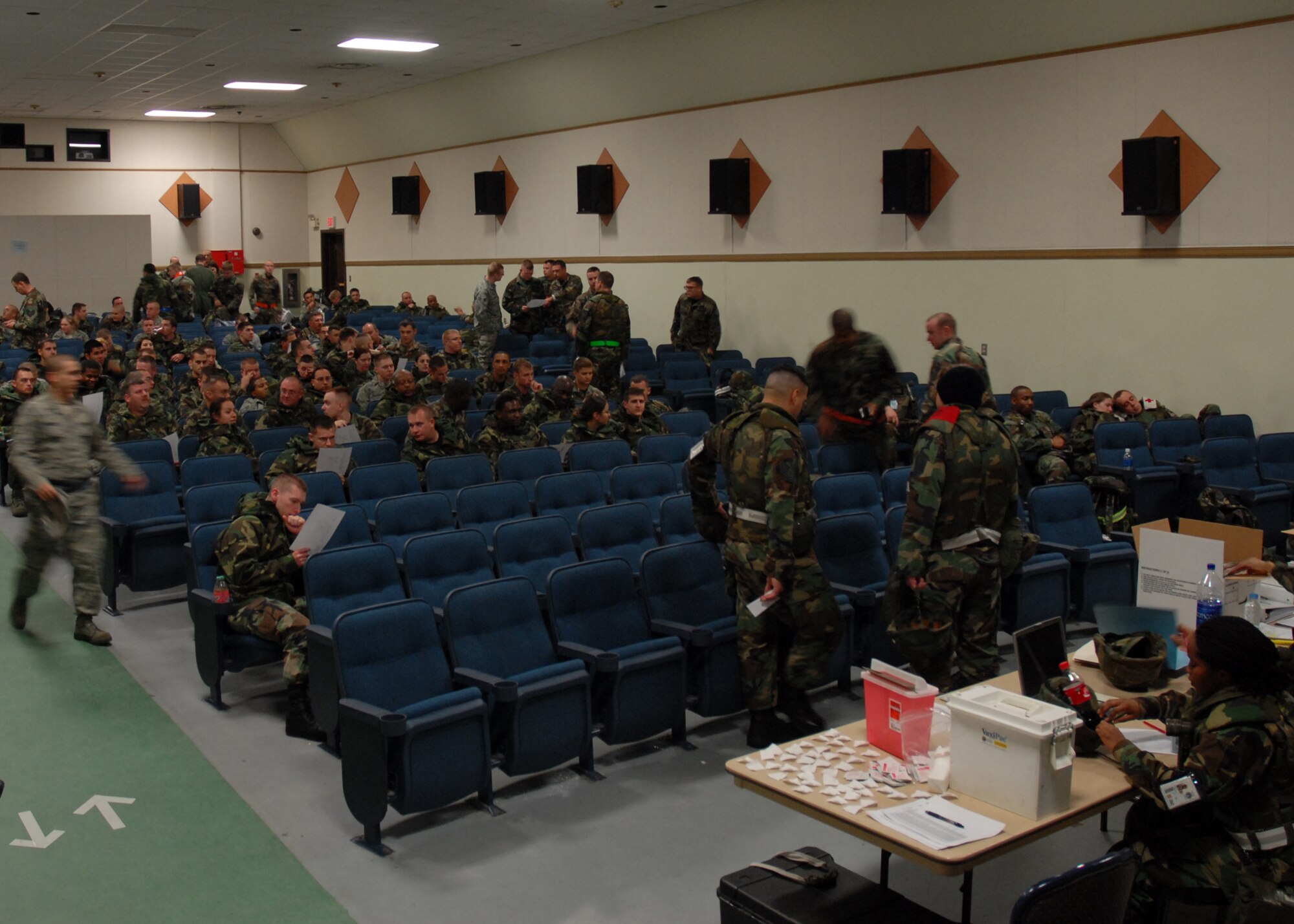 KUNSAN AIR BASE, South Korea -- Airmen from the 20th Fighter Wing, Shaw Air Force Base, S.C wait to receive briefing at the base theater here Jan. 14. The Airmen are deployed for a four-month Theater Security Package (TSP) that ensures peace and stability to the Pacific region. (U.S. Air Force Photo/Staff Sgt. Araceli Alarcon)

