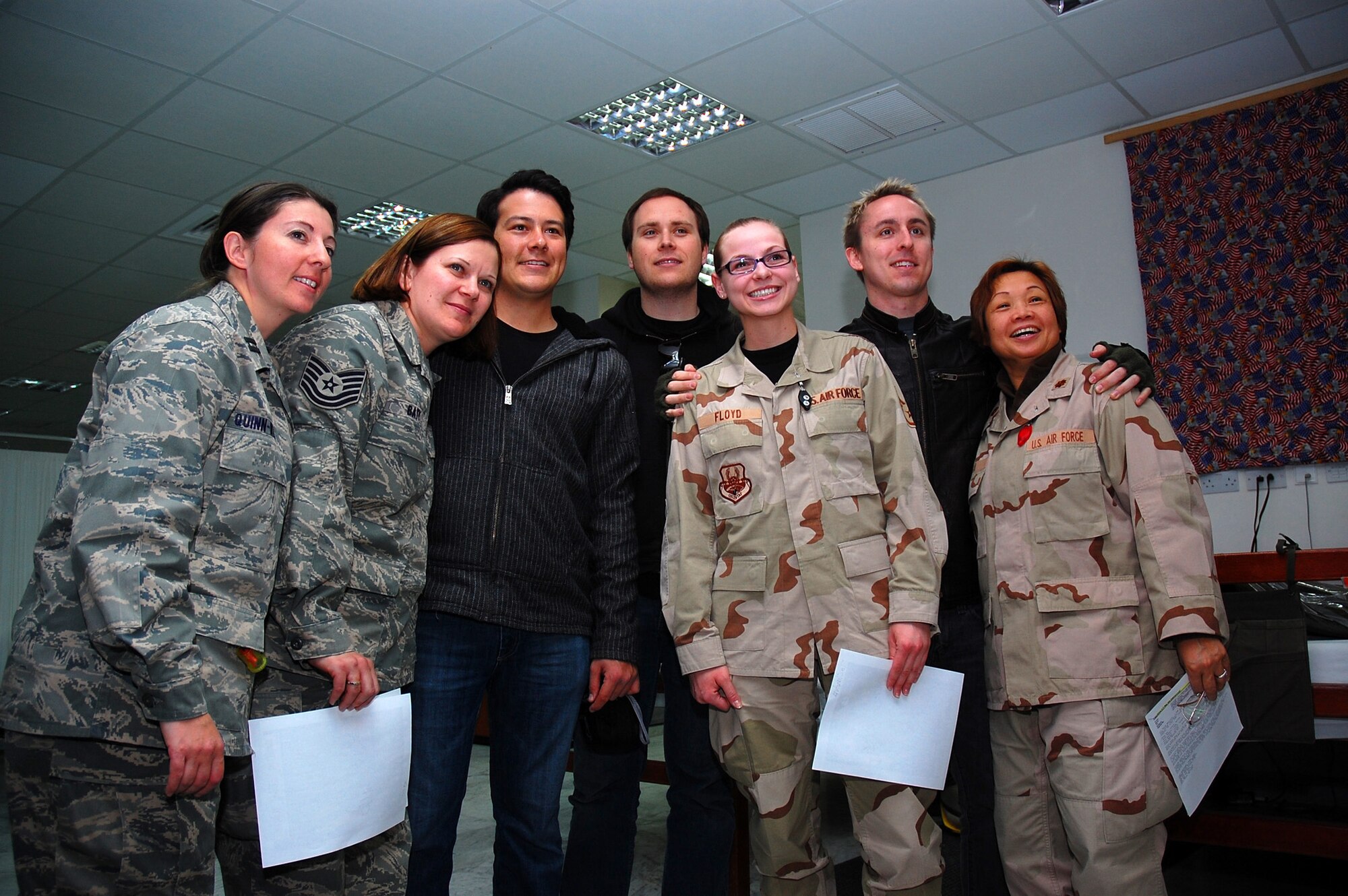 SOUTHWEST ASIA -- The 'Yellowcard' band poses for a group photo after signing autographs for U.S. servicemembers at the 386th Expeditionary Medical Group facility located on an air base in the Persian Gulf region Jan. 12, 2008, prior to Yellowcard's hour-long United Service Organizations' sponsored show.(U.S. Air Force photo/Senior Airman Patrick Dixon) (Released)
