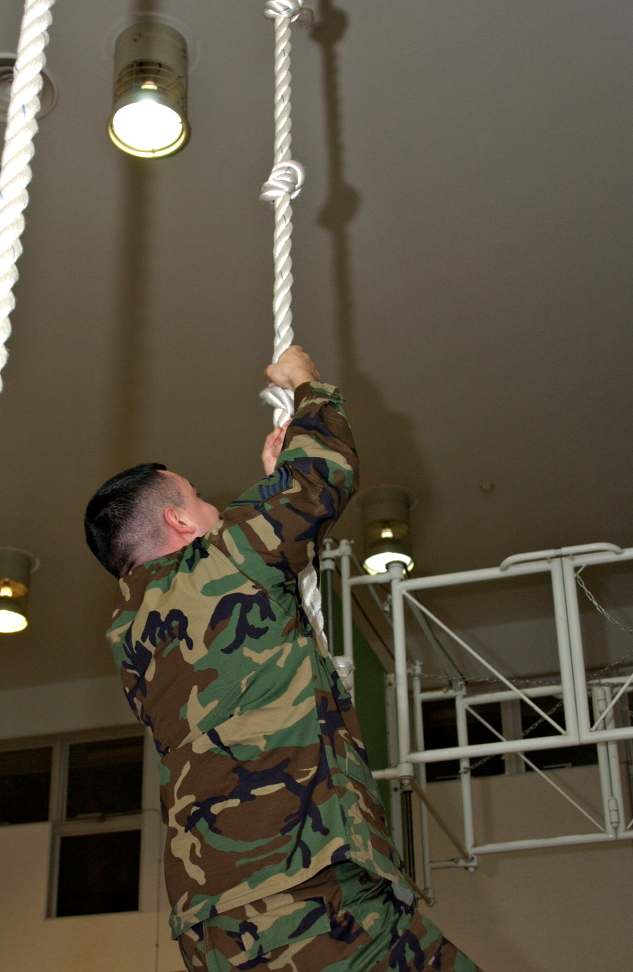 MISAWA AIR BASE, Japan -- Master Sgt. John Alsvig, 35th Maintenance Squadron first sergeant, climbs the rope at Cummings Elementary on Dec. 20, 2007. Cummings put out a challenge to first sergeants as well as anyone willing to compete for the fastest time climbing the rope. (U.S. Air Force photo by Airman 1st Class Eric Harris)