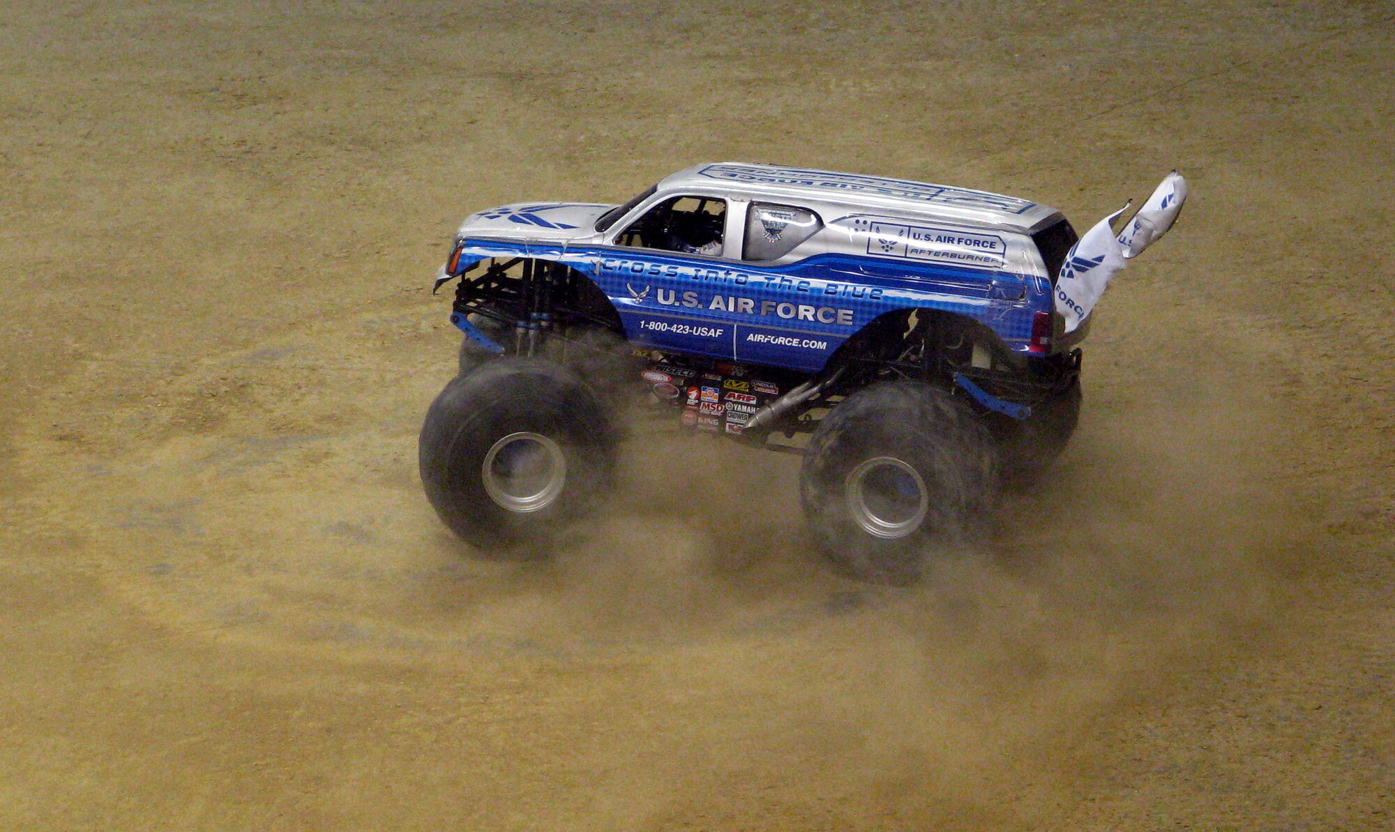 Afterburner, the Air Force's monster truck, dazzles the crowd Jan. 13 by doing donuts during the freestyle show at the 2008 San Antonio Monster Jam.  Afterburner, an Air Force recruiting tool, is driven by Damon Bradshaw.  (Courtesy photo/Jill Raney)