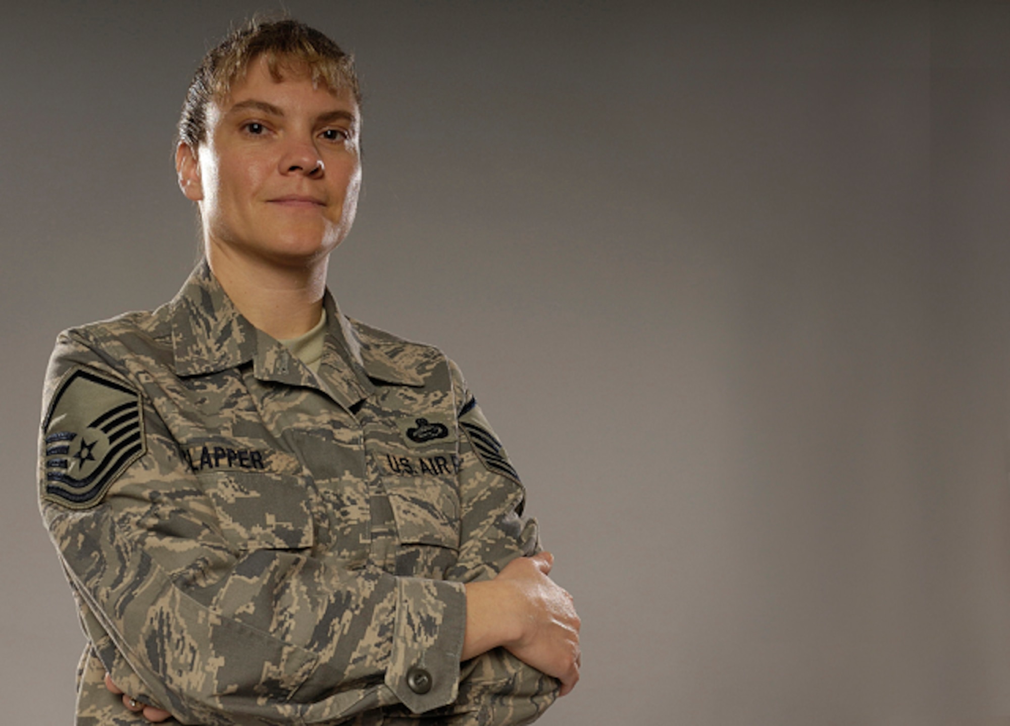 LANGLEY AIR FORCE BASE, Va. -- Air Force Master Sgt. Teresa Clapper became an "honorary gunny sergeant" after becoming the first Airmen to graduate at the top of her class at the Marine Corps Staff Noncommissioned Officer Academy Advance Course graduation Dec. 12 at Quantico, Va. (U.S. Air Force photo/Staff Sgt. Samuel Rogers)
