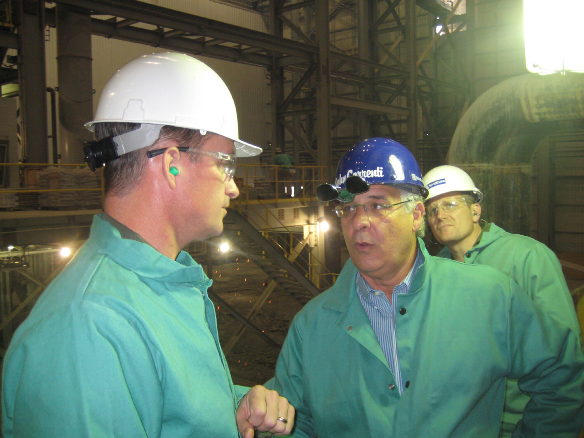 Colonel Dave Gerber, 14th Flying Training Wing commander, and Col. Jeff Dunn, 14th FTW vice commander, talk with John Correntti, CEO of SeverCorr, Thursday while touring the steel mill in Columbus, Miss. (U.S. Air Force photo by Bill Sherman)