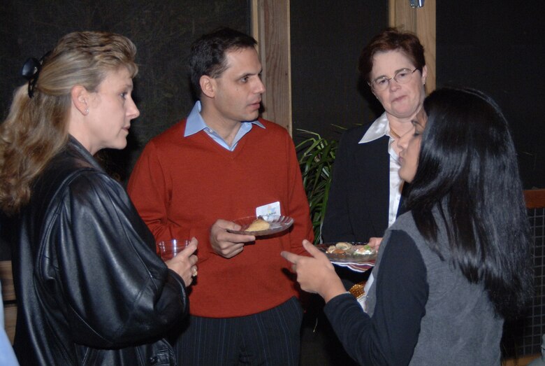 Lieutenant Col. Jane Denton, 14th Medical Operations Squadron commander, talks with her honorary commanders, Dr. Atiq Rehman and his wife, Dr. Shelia Atiq, and Col. Susan Hall, 14th Medical Group commander, Saturday.
 (U.S. Air Force photo by Airman 1st Class Danielle Hill)
