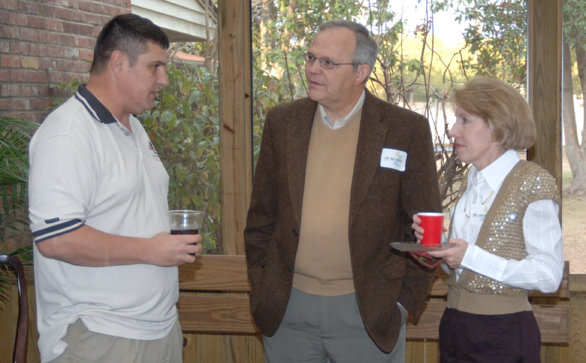 Chief Master Sgt. Ron Bowlan, 14th Flying Training Wing Command Chief Master Sergeant, talks with Rodney Roberts, 14th Civil Engineer Squadron, and his wife Lucille, Saturday during the wing commander’s New Year’s reception.  (U.S. Air Force photo by Airman 1st Class Danielle Hill)
