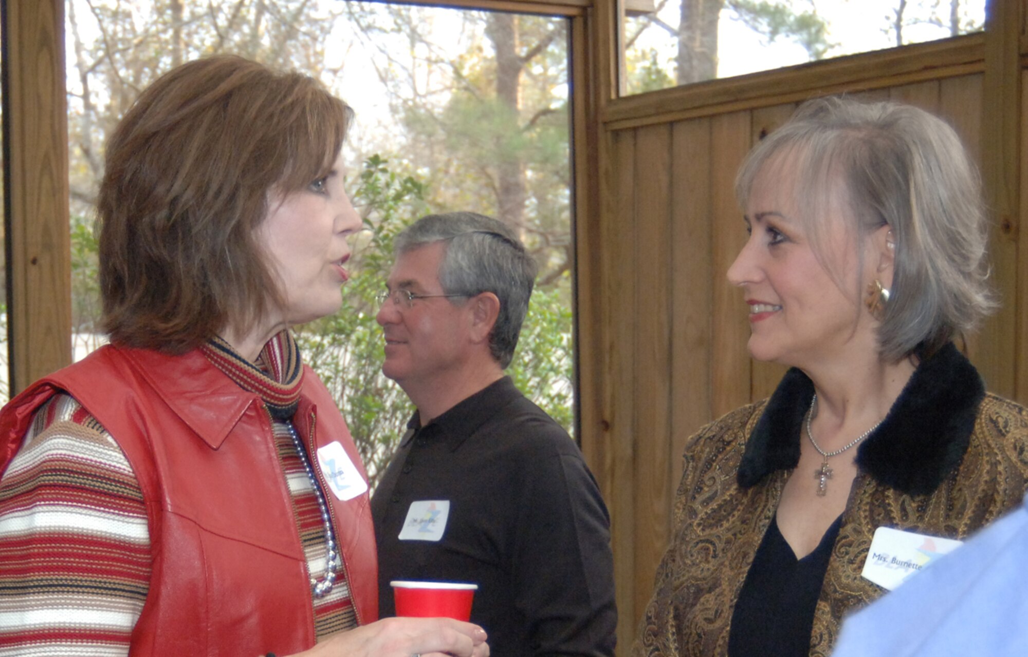 Susan Dunn, wife of Col. Jeff Dunn, 14th Flying Training Wing vice commander, talks with Burnette Avakian, owner of Shadowlawn, Saturday during the New Year’s reception hosted by Col. Dave Gerber, 14th FTW commander, and his wife Lousia.
 (U.S. Air Force photo by Airman 1st Class Danielle Hill)

