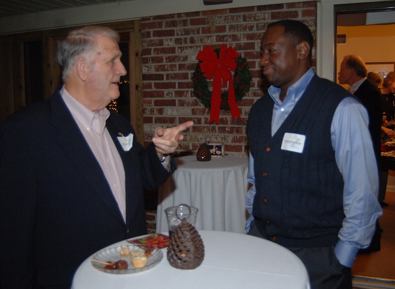 Colonel Mark Brown, 14th Mission Support Group commander, speaks with Columbus Wingman John Laws during Col. Gerber’s New Year’s reception Saturday. (U.S. Air Force photo by Airman 1st Class Danielle Hill)