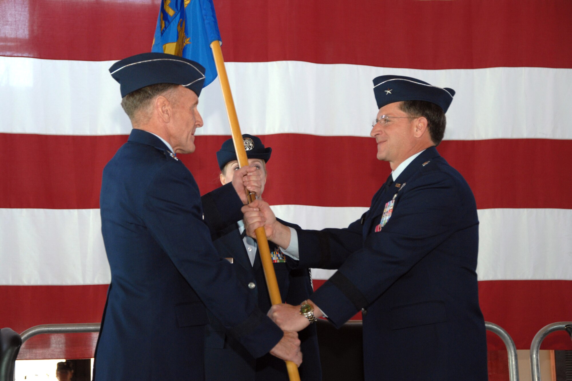 Brig. Gen. David Goldfein passes the guidon to Lt. Gen. Norman Seip, 12th Air Force commander, and relinquishes command of the 49th Fighter Wing during a change of command ceremony Jan. 11, 2008, at Holloman Air Force Base, N.M. General Goldfein will take over as the deputy chief of staff, Strategic Plans and Programs, for Headquarters United States Air Force at the Pentagon in Washington, D.C. (U.S. Air Force photo/Airman 1st Class Jamal D. Sutter)