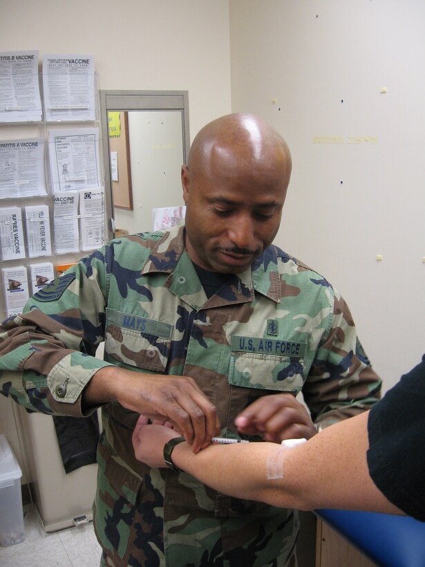 WRIGHT-PATTERSON AFB, Ohio - Tech. Sgt. LeTroy Mays, 445th Aerospace Medicine Squadron, gives the tuberculosis skin test to 445th Airlift Wing reservists during annual physicals at the base clinic January 12, 2008.  Physicals are conducted by AMDS once a month to keep 445th members worldwide qualified.  (U.S. Air Force photo/Tech. Sgt. Charlie Miller)