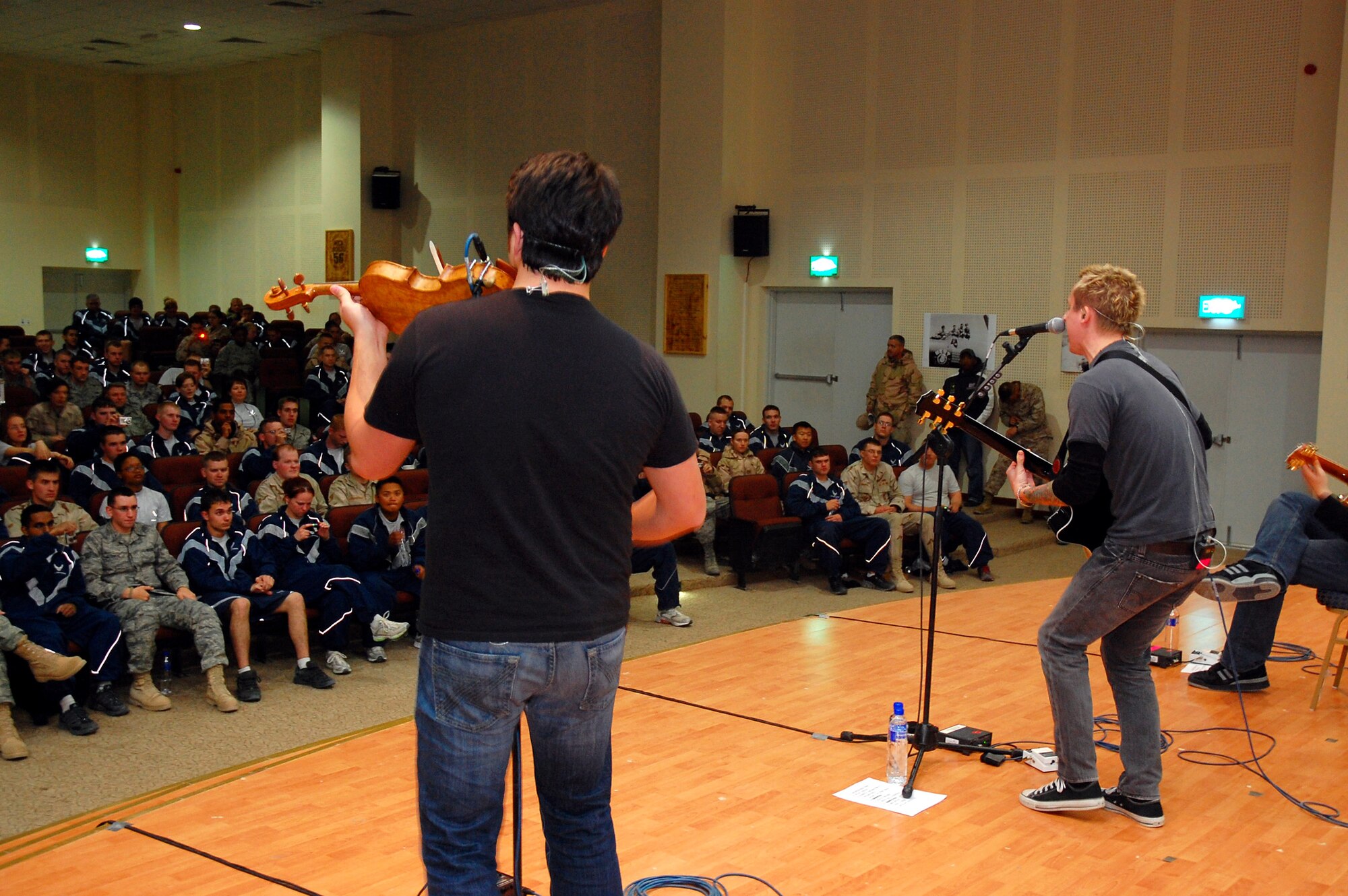 More than 250 servicemembers enjoy an hour-long performance by the Yellowcard band Jan. 12 at a Southwest Asia air base. The tour was a way for the band to say thank you to American servicemembers on their five-day United Service Organizations' tour. (U.S. Air Force photo/Senior Airman Patrick Dixon)