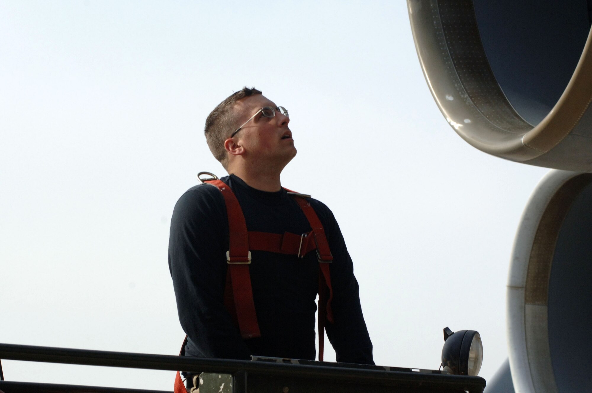Staff Sgt. Charlton Packham uses a condor lift to access the top of a C-5 Galaxy Jan. 12 at Balad Air Base, Iraq. The C-5 can hold a cargo load of 270,000 pounds, fly 2,150 nautical miles, offload and fly to a second base 500 nautical miles away from the original destination without refueling. Sergeant Packham, a 721st Air Mobility Operations Group Det. 5 maintainer, is deployed from Travis Air Force Base, Calif. (U.S. Air Force photo/Senior Airman Terri Barriere) 
