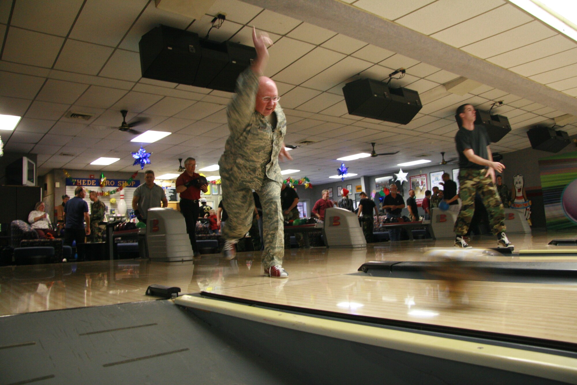 Col. Richard Ayres, 17th Training Wing commander, lets a bowling ball fly at the tournament at the Thede Bowling Center Dec. 17 , following the dedication of the new pin machines. (U.S. Air Force photo by Julie Manuel)
