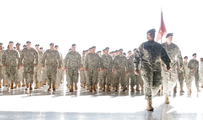 Soldiers from the U.S. Army’s 257th Transportation Company enter hangar 290 prior to a pre-deployment ceremony held here, Jan.11. More than 100 soldiers from the 257th are scheduled to deploy Jan. 13 to forward operating locations in support of Operation Iraqi Freedom. (U.S. Air Force photo by Staff Sgt. Jacob R. McCarthy)