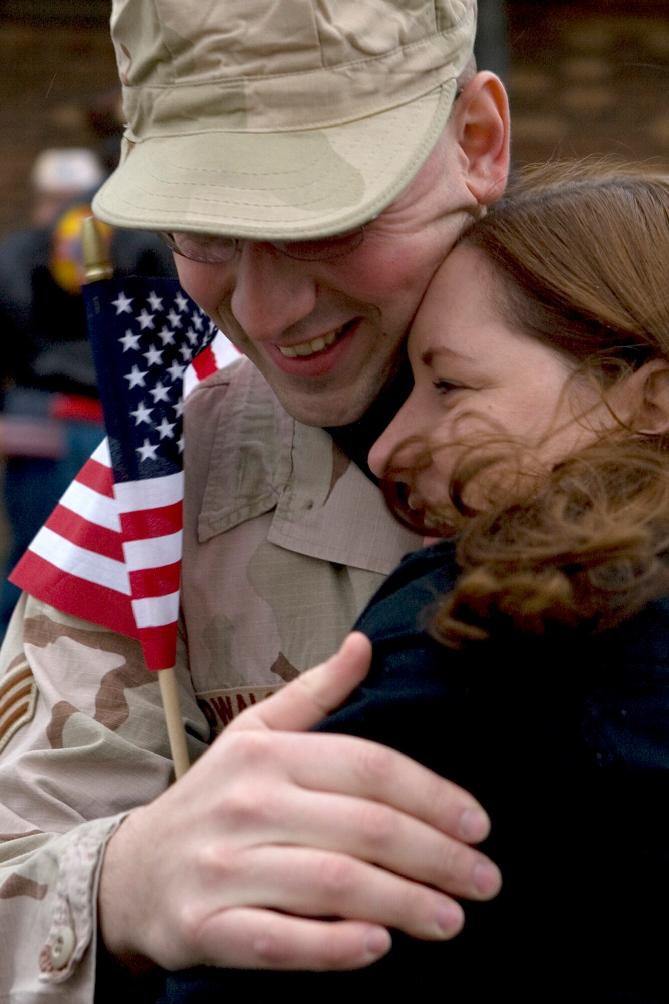 GRISSOM AIR RESERVE BASE, Ind. --  Senior Airman Christopher Kowalski, 434th Security Forces Squadron, is welcomed home by his sister Staff Sgt. Elizabeth Kowalski, 434th Operation Support Squadron, Jan. 13. Airman Kowalski and three other security forces members returned following a six-month deployment. The group provided air base ground defense security to forces stationed at Kirkuk, Air Base, in Iraq. (U.S. Air Force photo/Senior Airman Omar Delacruz)