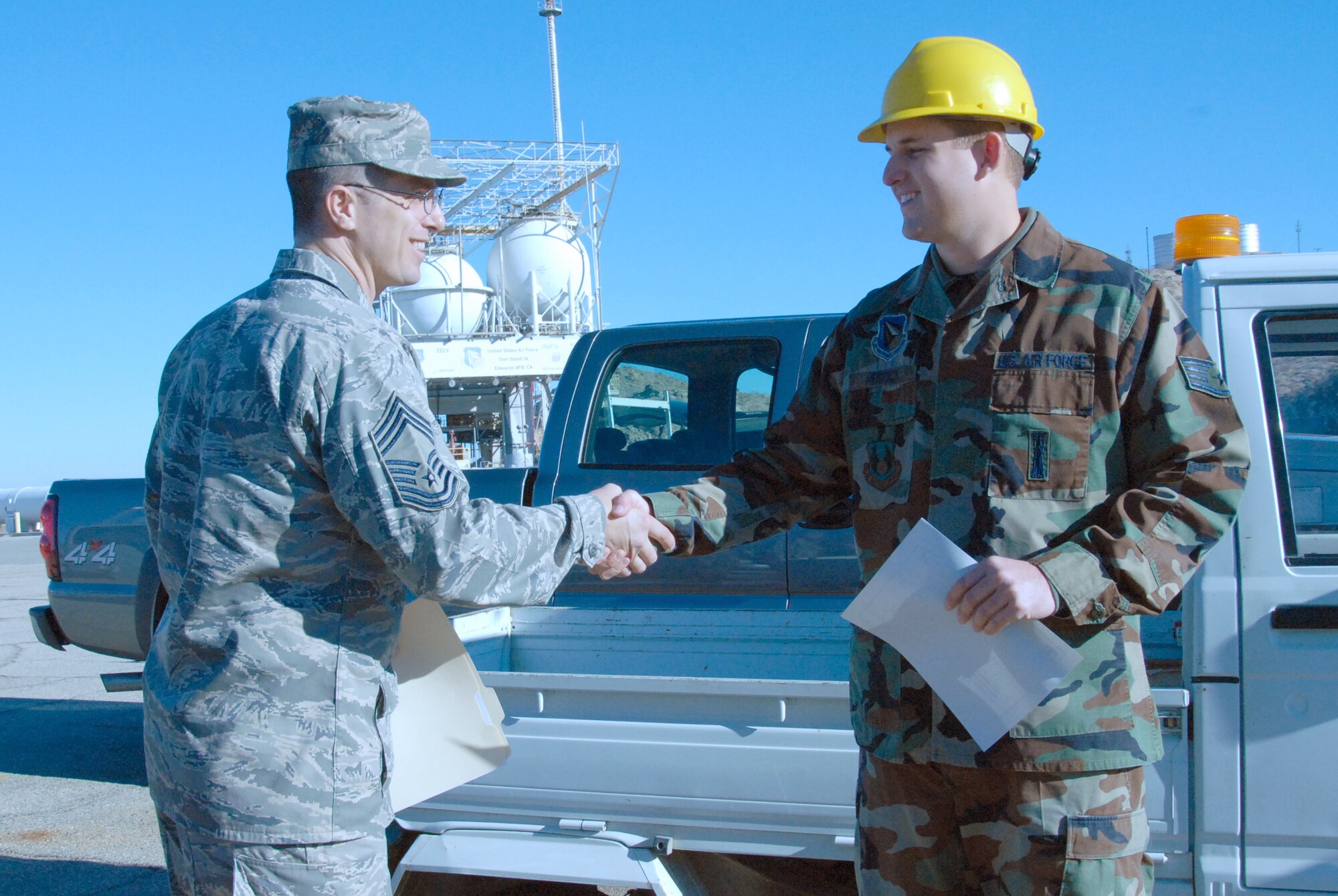 Chief Master Sgt. Eric Jaren, 95th Mission Support Group superintendent, congratulates Staff Sgt. Kyle Herrick, Air Force Research Laboratory propulsion laboratory mechanic, for receiving the Chief's Group's Dare to Soar award. The Dare to Soar award is presented to Airmen for outstanding performance. (Photo by Airman 1st Class Stacy Sanchez)
