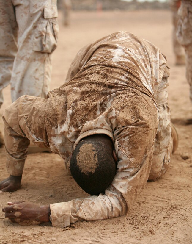 Cpl. Deon Edwards, a LAAD gunner and Chicago, Ill. native with Batter B, 3rd Low Altitude Air Defense Battalion, struggles to keep his bearing after finishing the ammo resupply portion of the Combat Fitness Test Jan. 14. Consisting of events that replicate the physical demands of combat, the CFT will include a wide range of challenging exercises, from carrying a simulated battlefield casualty to maneuvering under enemy fire.