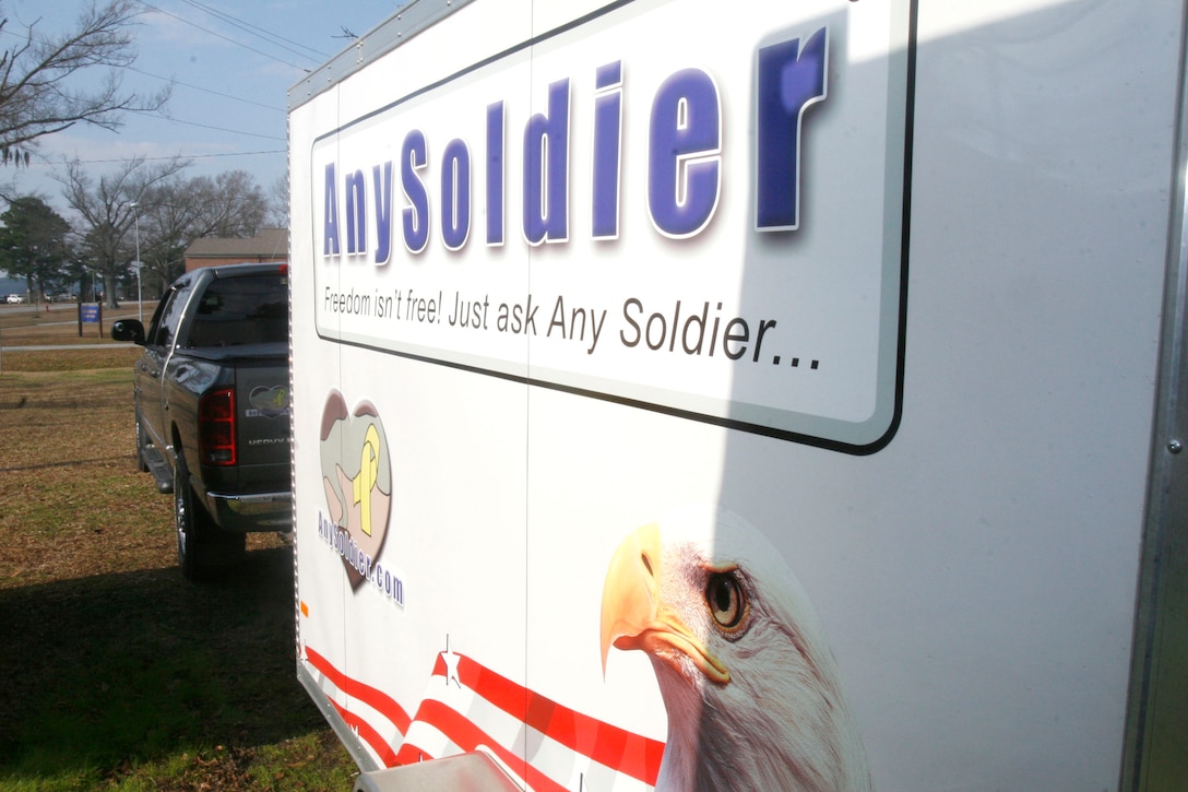 A decorative trailer displays the slogan for AnySoldier.com, a website dedicated to sending support for deployed servicemembers.  Marty Horn, president of the organization, and Air Force Reserve Lt. Col. Scott Remington, support team director, recently visited the Wounded Warrior Barracks, Wounded Warrior Battalion-East, Wounded Warrior Regiment, Manpower and Reserve Affairs, here Jan. 14 to donate entertainment products and other items to show their appreciation for the wounded Marines and sailors.