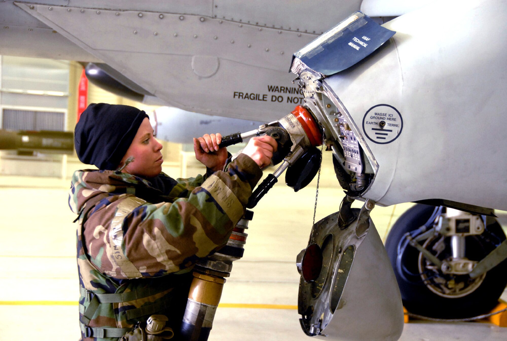 OSAN AIR BASE, Republic of Korea --Senior Airman Rebecca Paz, assigned to the 51st Aircraft Maintenance Squadron, fuels an A-10 Thunderbolt II with JP-8 fuel during a peninsula-wide exercise on Osan Air Base.  The operational readiness exercise tests Team Osan's ability to execute combat operations, receive follow-on forces and defend the base from attack.  (U.S. Air Force Photo by Staff Sgt Ronnie Hill)