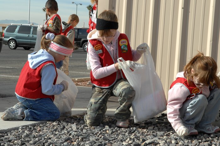 Children from Approved Workmen Are Not Ashamed (AWANA) clean up Nellis as part of a volunteer event dedicated to improving Nellis’ community appearance, Jan. 12. AWANA's is a religious youth group for children between ages two to 18, whose goal is to raise spiritual awareness among its members and seek out volunteer opportunities. (U.S. Air Force photo by Senior Airman Nadine Y. Barclay)