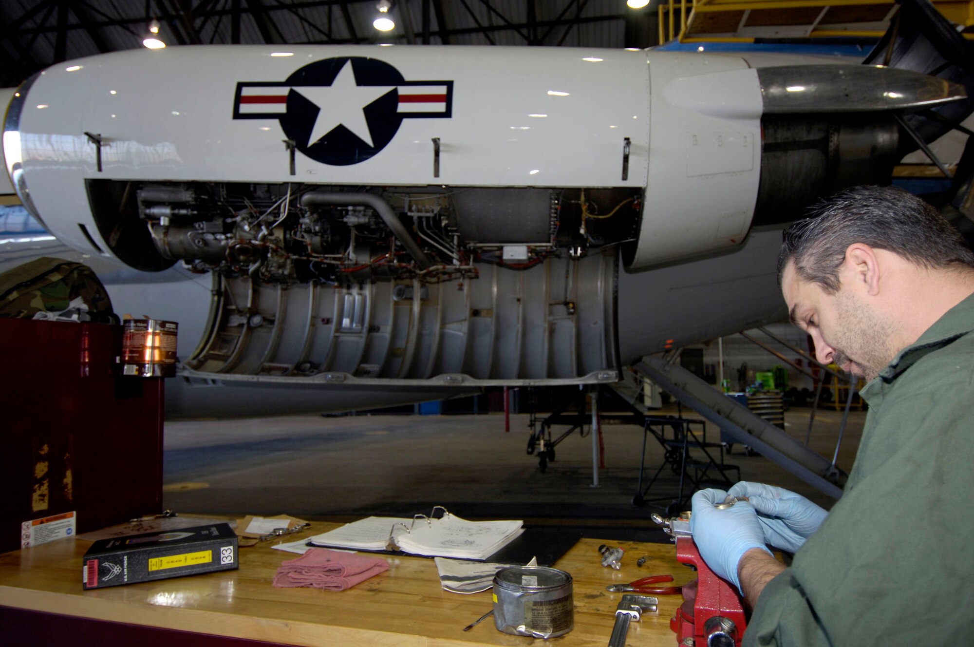 James Mattingly, an aerospace propulsion craftsman from the 932nd Maintenance Group, 932nd Airlift Wing, changes an air filter on a C-9C Skytrain aircraft in hangar one, Scott AFB, Ill.  Assigned to the 932nd Airlift Wing, the C-9C, along with the C-40C handles distinguished visitor airlift.
U.S. Air Force photo/Tech. Sgt. Tony R. Tolley
