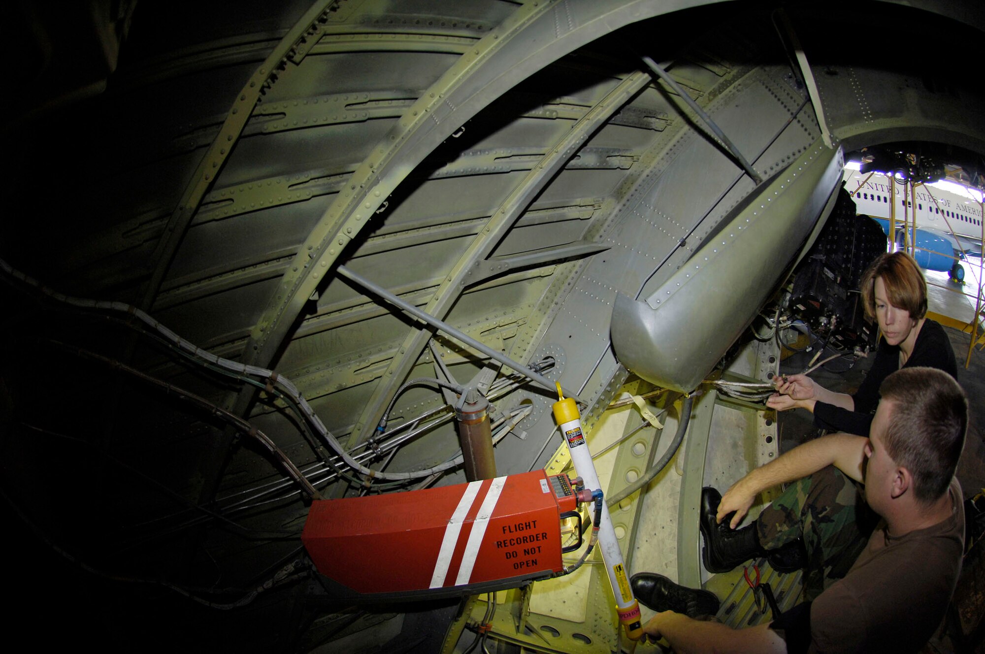 Master Sgt. Jennifer Glaspell and Airman 1st Class David Williams, crew chiefs from the 932nd Maintenance Group, 932nd Airlift Wing, prepare to replace clamps on hydraulic lines of a C-9C aircraft in hangar one, Scott AFB, Ill.  Assigned to the 932nd Airlift Wing, the C-9C, along with the C-40C, provide safe, comfortable and reliable transportation for dignitaries such as the first lady, the chairman of the joint chief of staff, and other U.S. leaders to locations around the world.  
U.S. Air Force photo/Tech. Sgt. Tony R. Tolley (Released)
