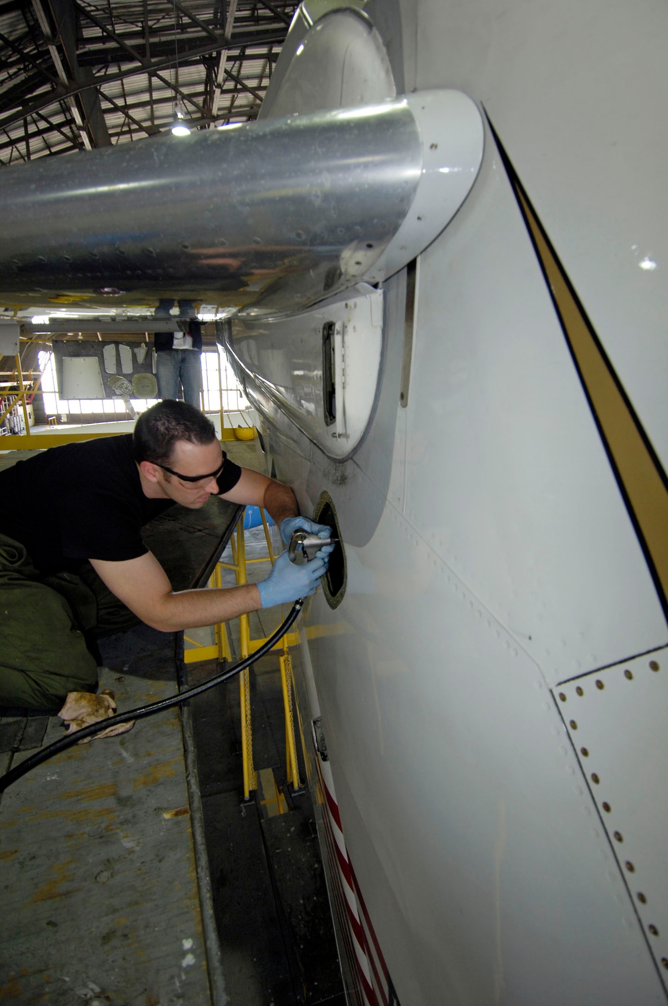 Senior Airman Kevin Jackson, a crew chief from the 932nd Maintenance Group, 932nd Airlift Wing, lubes a jack screw on the tail stabilizer of a C-9C Skytrain aircraft in hangar one, Scott AFB, Ill.  Assigned to the 932nd Airlift Wing, the C-9C, along with the C-40C, provide safe, comfortable and reliable transportation for dignitaries other U.S. leaders to locations around the world.  
U.S. Air Force photo/Tech. Sgt. Tony R. Tolley

