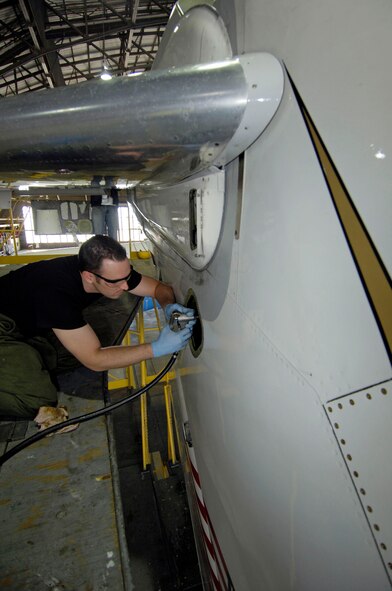 Senior Airman Kevin Jackson, a crew chief from the 932nd Maintenance Group, 932nd Airlift Wing, lubes a jack screw on the tail stabilizer of a C-9C Skytrain aircraft in hangar one, Scott AFB, Ill.  Assigned to the 932nd Airlift Wing, the C-9C, along with the C-40C, provide safe, comfortable and reliable transportation for dignitaries other U.S. leaders to locations around the world.  
U.S. Air Force photo/Tech. Sgt. Tony R. Tolley
