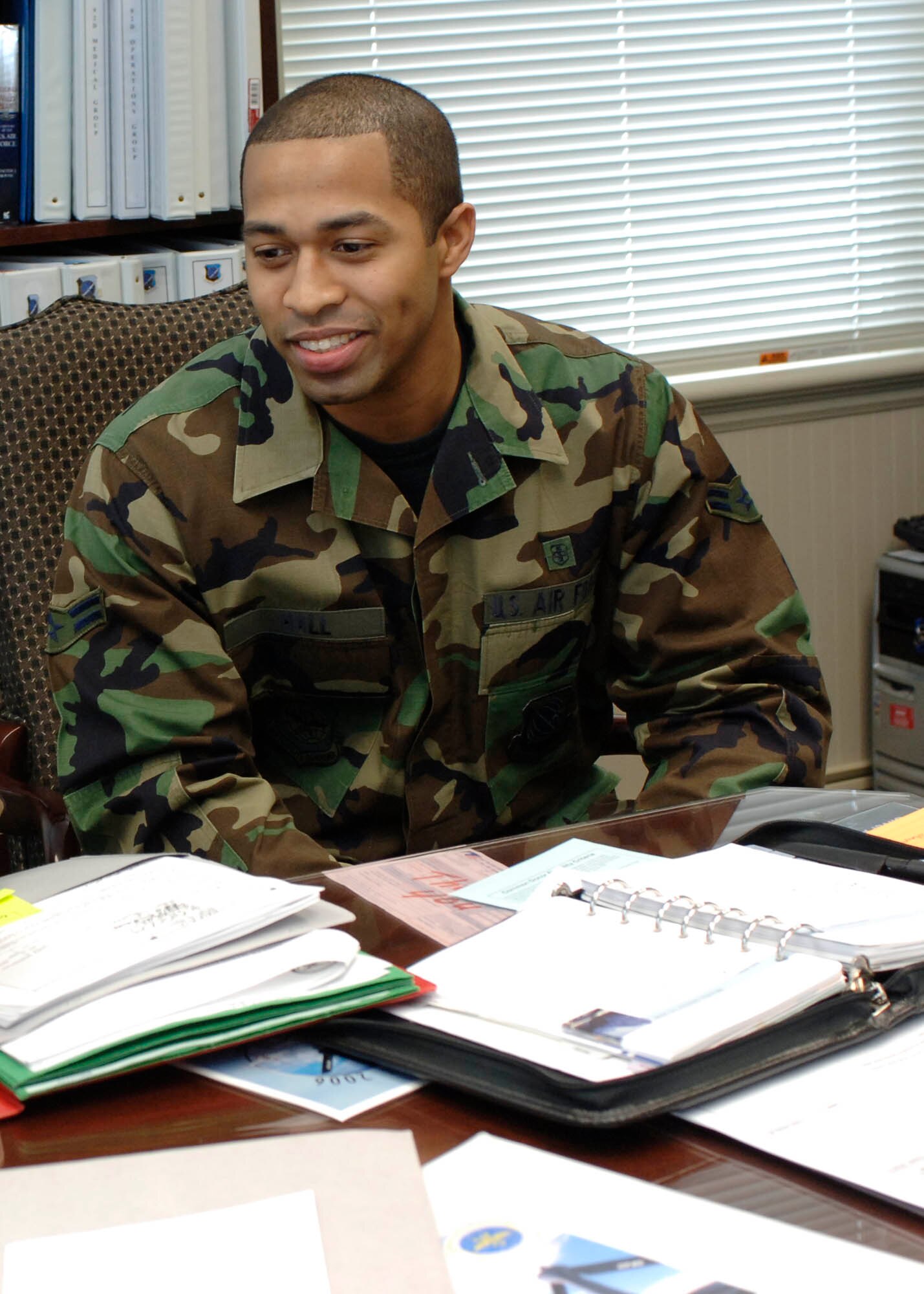 FAIRCHILD AIR FORCE BASE, Wash. –Airman 1st Class David Hall, 92nd Medical Operations Squadron medical technician, looks over paper work as part of the Commander’s Shadow Program on Jan. 14. The shadow program is a chance for Col. Thomas Sharpy, 92nd Air Refueling Wing commander, to enlighten sharp Airmen on what it is like to be a commander. Individuals who are chosen get to spend a day with the base commander and learn what the job entails. (U.S. Air Force photo/Staff Sgt. JT May III)