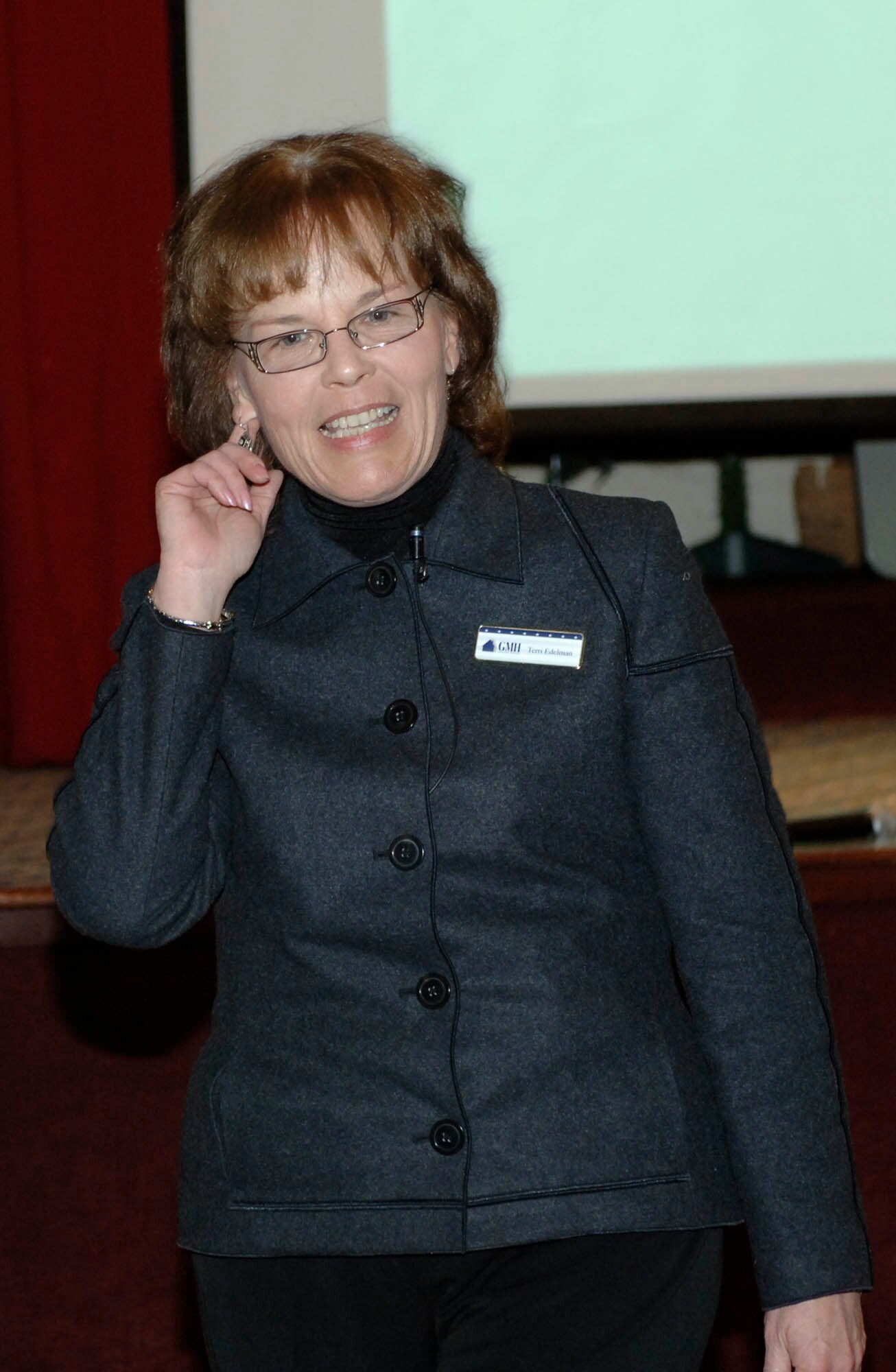 FAIRCHILD AIR FORCE BASE, Wash. –Terri Edelman, Government Military Housing vice president of community management, speaks to Fairchild military housing residents about privatization at Club Fairchild on Jan. 14. Topics of discussion ranged from leasing to layout styles of newly built homes. One topic that seemed to gain the approval of the audience involved the inclusion of outdoor maintenance services, such as cutting grass and shoveling snow, that will be a provided as a result of privatization. (U.S. Air Force photo/Staff Sgt. JT May III)