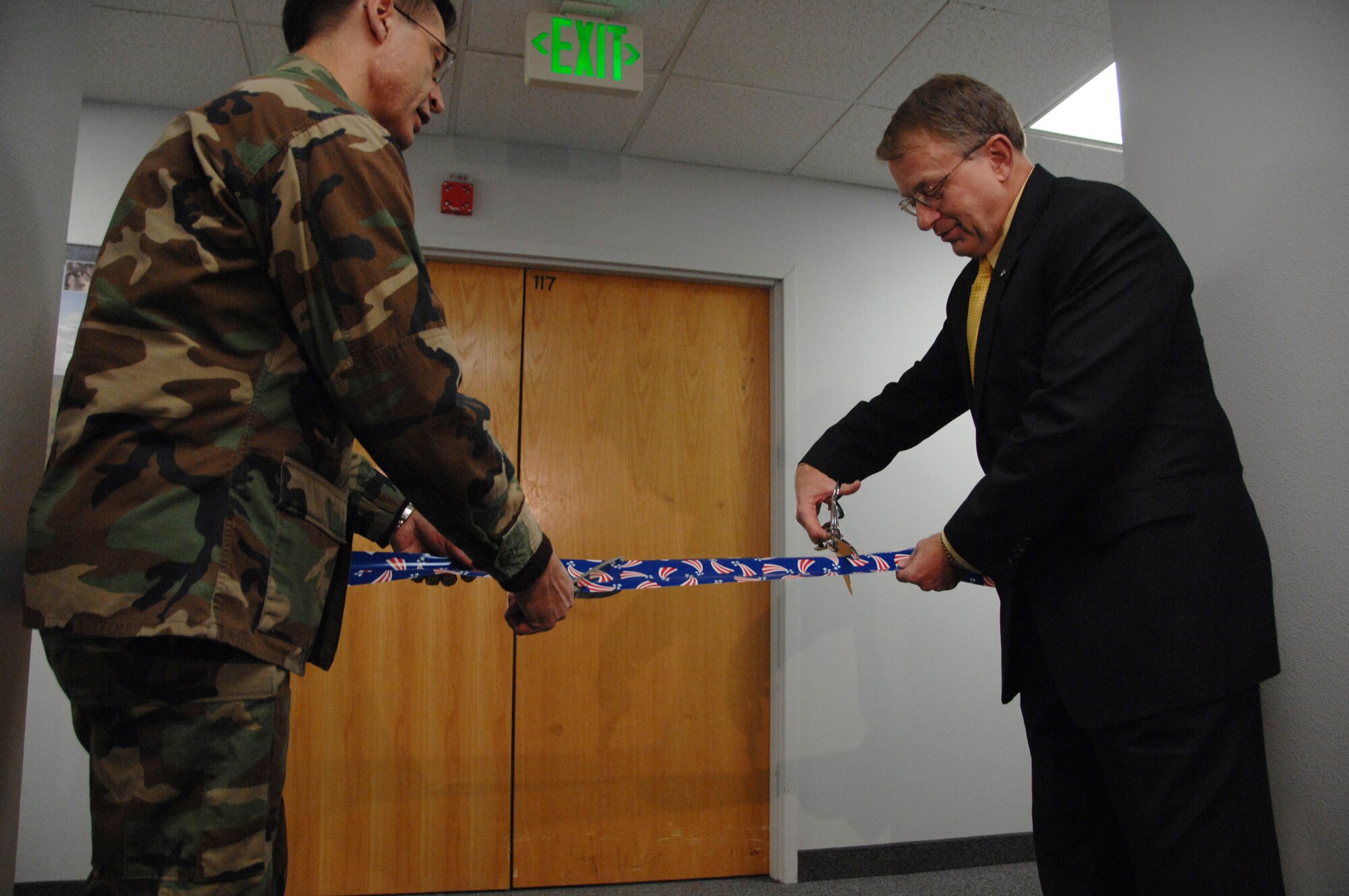 EIELSON AIR FORCE BASE, Alaska -- Col. John Stutts, 354th Mission Support Group commander, and Steven Jones, Chancellor of the University of Alaska Fairbanks, cut the ribbon leading into the new testing center Jan. 11, 2008, at the education office. The University of Alaska Fairbanks has recently established the National Testing Center at Eielson. The center will serve Airmen by providing College Level Examination Program (CLEP) and the Defense Activity for Non-Traditional Education Support (DANTES) tests.. (U.S. Air Force photo by Airman 1st Class Christopher Griffin) 