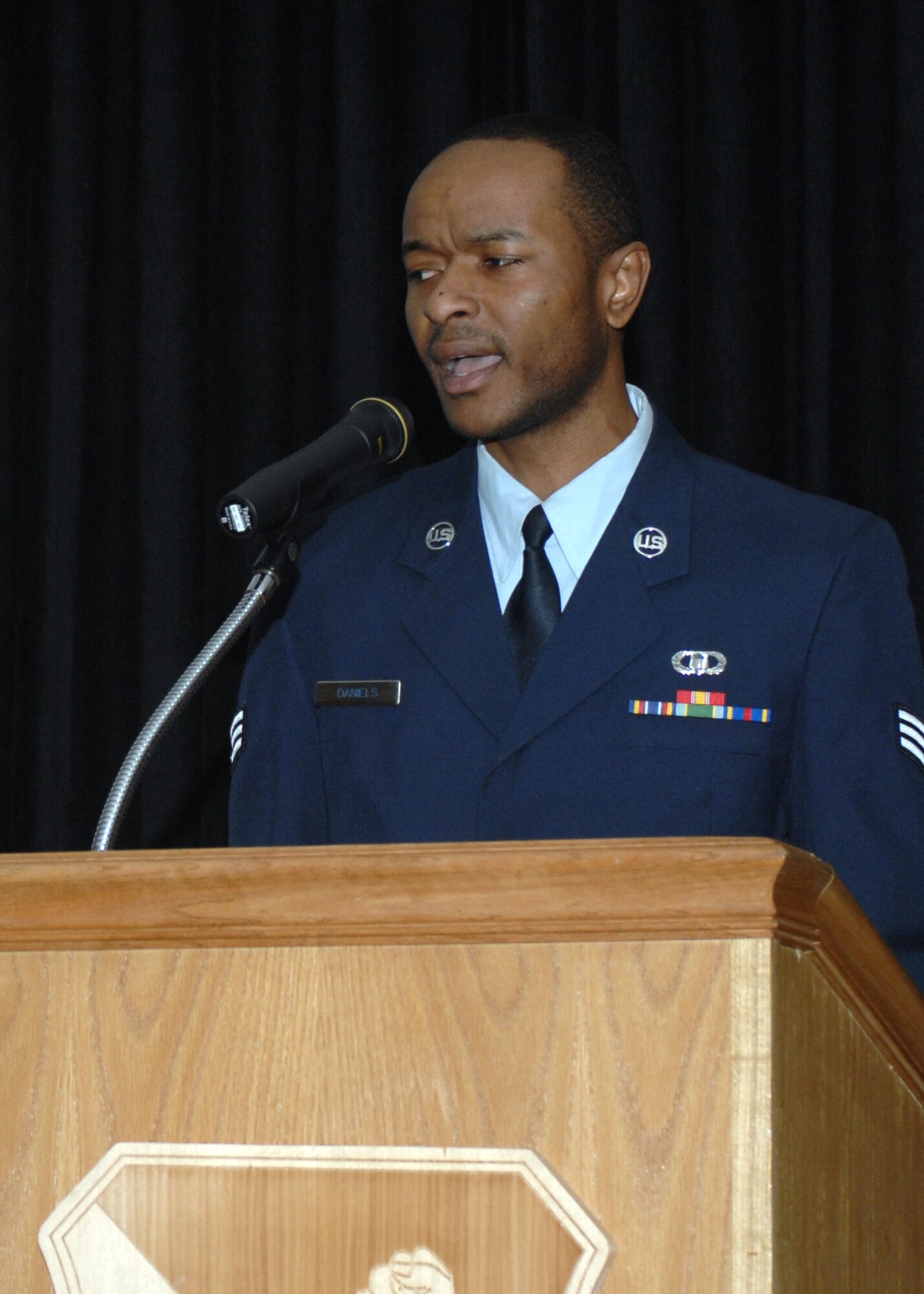 CANNON AIR FORCE BASE, N.M. - Senior Airman Emanuel Daniels, 27th Special Operations Support Squadron, sings the national anthem at the Martin Luther King Jr. memorial breakfast Jan. 15. The breakfast, hosted by the Cultural Observance Committee, was held at the Landing in honor of Dr. King's birthday Jan. 17. (U.S. Air Force photo by Airman 1st Class James Bell)