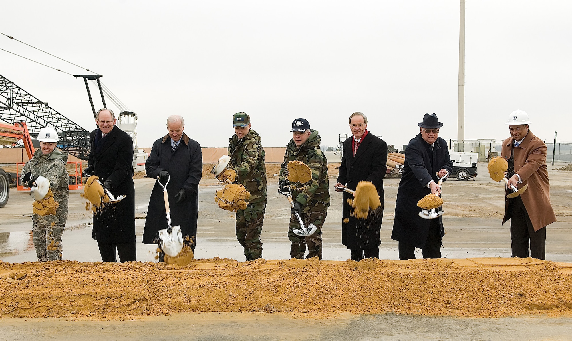 From left, Lt. Col. Gwen Baker, U.S. Army Corps of Engineers district commander; U.S. Rep. Mike Castle; U.S. Sen. Joseph Biden; Col. Steven Harrison, 436th Airlift Wing commander; Col. Randal Bright, 512th Airlift Wing commander; U.S. Sen. Thomas Carper; Dover Mayor Carlton Carey; and Fred Parker, president of Tetra Tech Facilities Construction, break ground for the air traffic control facility Jan. 14 at Dover Air Force Base.  The $15.6 million facility is scheduled for completion in 2009.  (U.S. Air Force photo by Jason Minto)