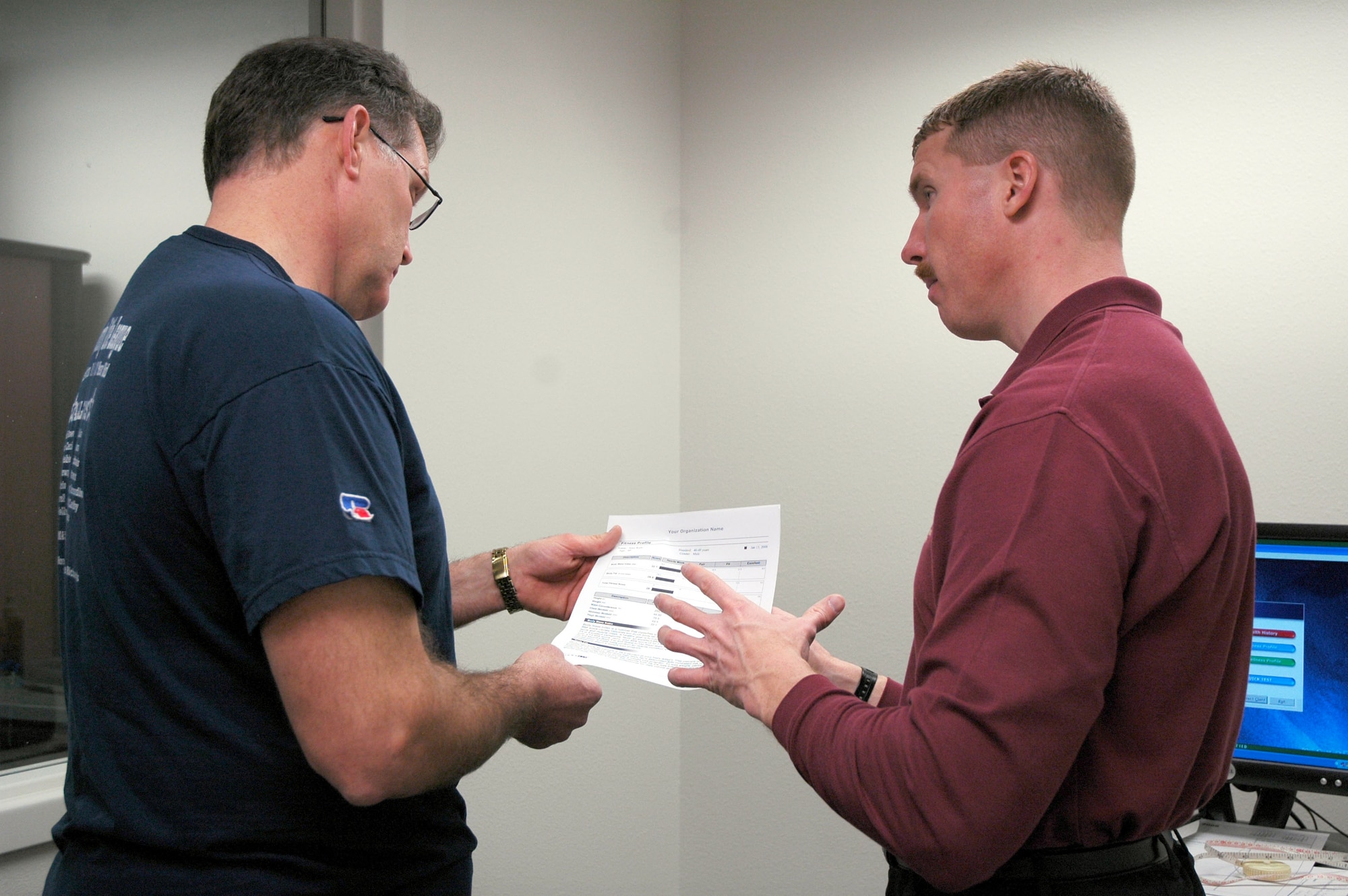 Kirk Clark, physiologist at the Health and Wellness Center, explains the results to Largest Loser participant Jerry Kain, after his initial assessment Jan. 15. Mr. Kain has agreed to be followed through the course of his participation in the program which will run until April 4. (U.S. Air Force photo/Valerie Mullett)