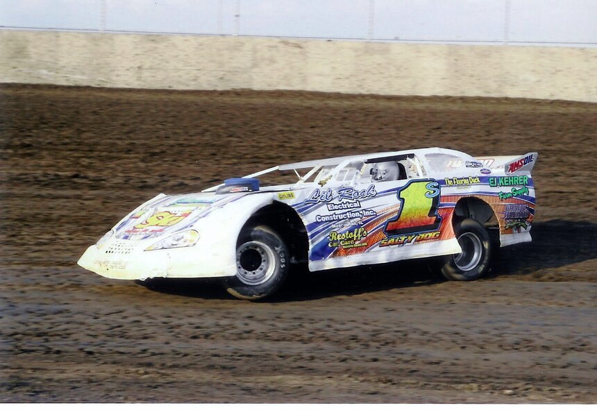 The Salter family has been
associated with Scott
AFB for a long time. 

Bob came to Scott as an active duty staff
sergeant in 1969. Currently, he is a senior
master sergeant and Air Reserve
Technician with the 932nd Maintenance
Squadron (MXS). 

His wife, Deb, has been employed for the last 16 years at
the Contractor Operated & Maintained
Base Supply (COMBS) for the C-9
aircraft.

Eight years ago, they also embarked
on another career. Along with
their son and driver, Rick, they are
owners of a stock car racing team, aptly
named Salty Dog Racing.

The team spent three years in the
Sportsman division before moving up
to a Super Late Model, the premier dirt
track division in the country.  Sergeant Salter explained:

“It didn’t take long to see that Rick
definitely has what it takes. The team
has been improving steadily year by
year. We are a family owned and operated
team. Our budget is extremely low
compared to most teams we race.

“But, we have reached a point now
where Rick is seen as a potentially top
contender at any track where we go.

"What Rick does on the track is a constant
source of amazement for Deb and
me. He’s an aggressive, cool-headed
driver, and his mother and I couldn’t
be prouder of him,” said the sergeant.

The 2007 season has been the best
year yet for Salty Dog Racing. On Sept.
29, Rick clinched the Super Late Model
Season Championship at Highland
Speedway. He also finished the season
with a strong 5th place in points at Tri-
City Speedway.

Rick pointed out, “I couldn’t have
come this far without the support of my
parents and crew. Dad is my crew chief
and his years of leadership experience
and his mechanical expertise are essential
to our success. Mom is our bookkeeper
and team cook.

“One or both of them are at the
track every time I race. Because of their
continuing love and support, I am living
my dream,” Rick added.