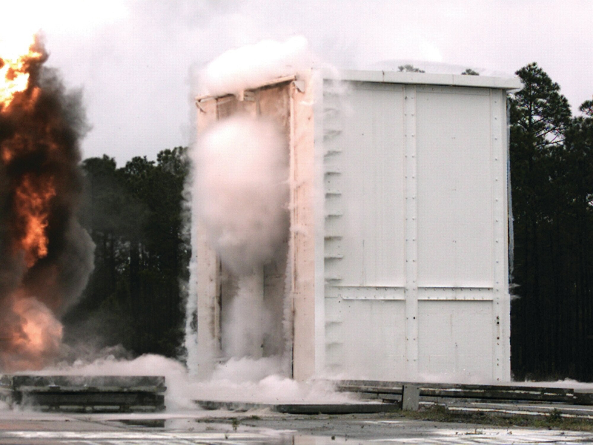 Blast pressure hitting precast concrete wall panels creates water vapor clouds that evaporate a few milliseconds later.