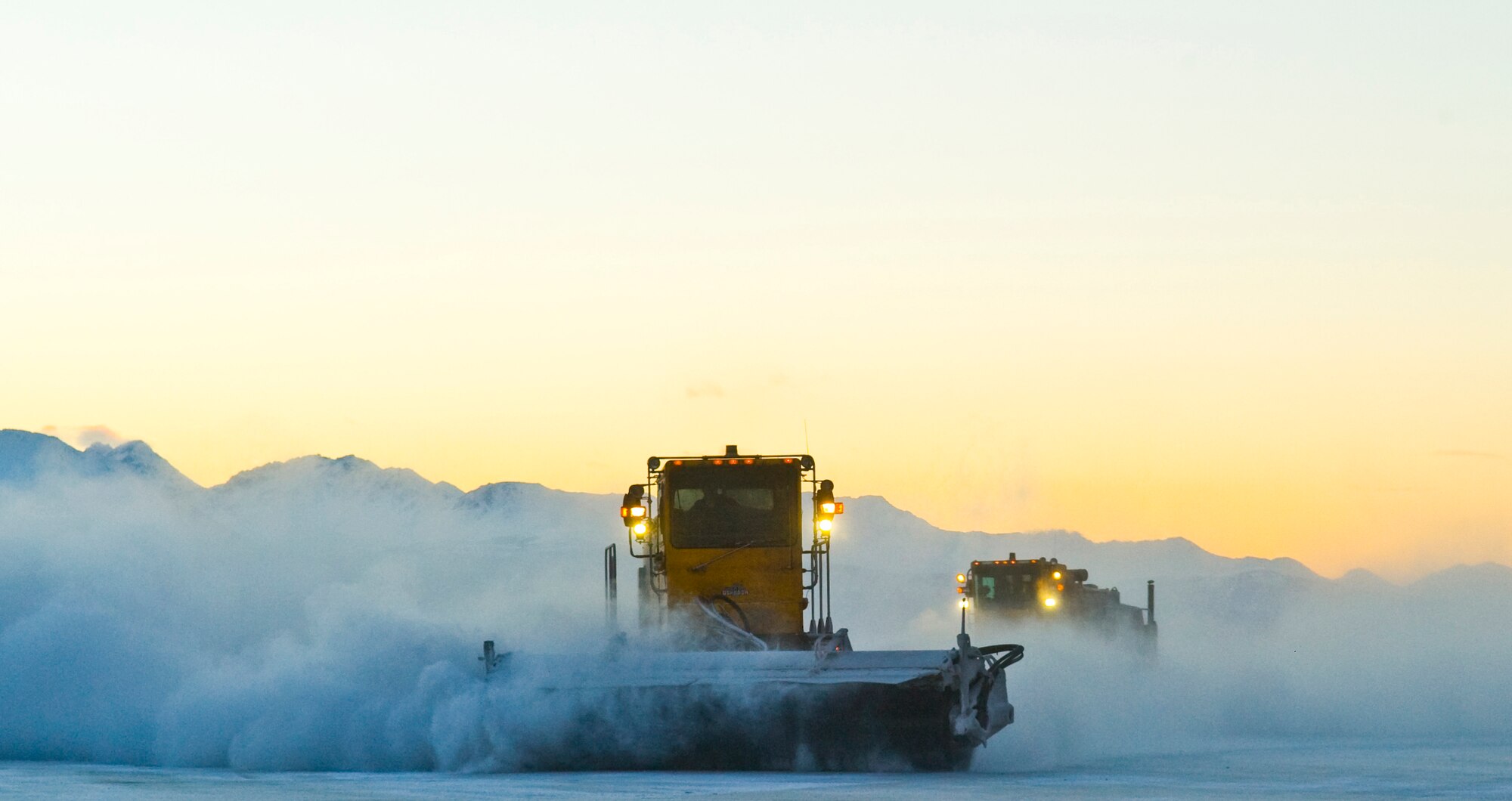 ELMENDORF AIR FORCE BASE, Alaska - Members of the 3rd Civil Engineer Squadron Snow Removal flight clear snow from Elmendorf?s runways early morning Jan. 13, 2008. The Elements of Elmendorf, if not maintained daily, can halt flying operations. (U.S. Air Force photo/Senior Airman Garrett Hothan)