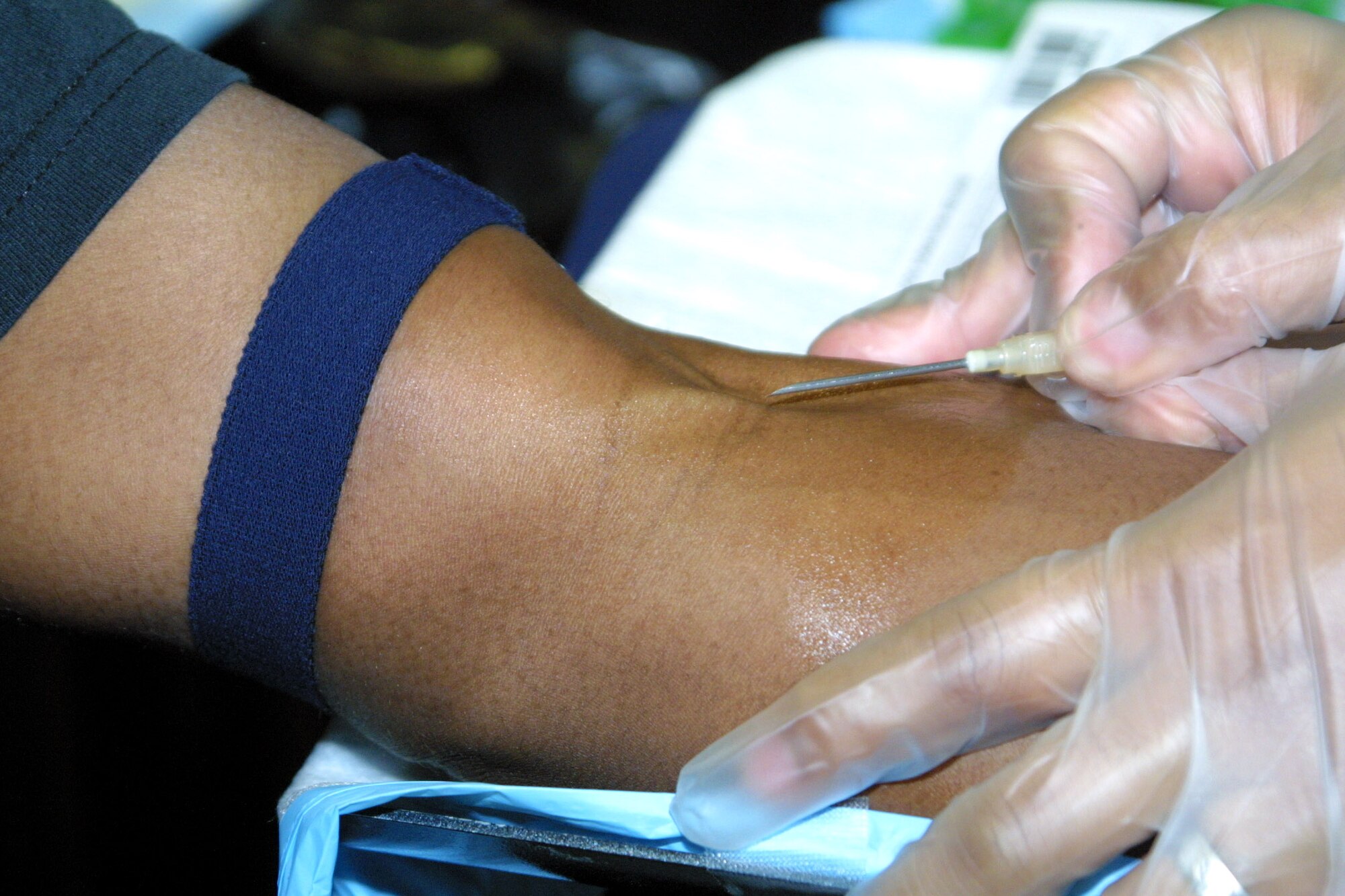 An Armed Services Blood Program member prepares to take a donation from a donor at Pope Air Force Base, N.C. (U.S. Air Force photo)