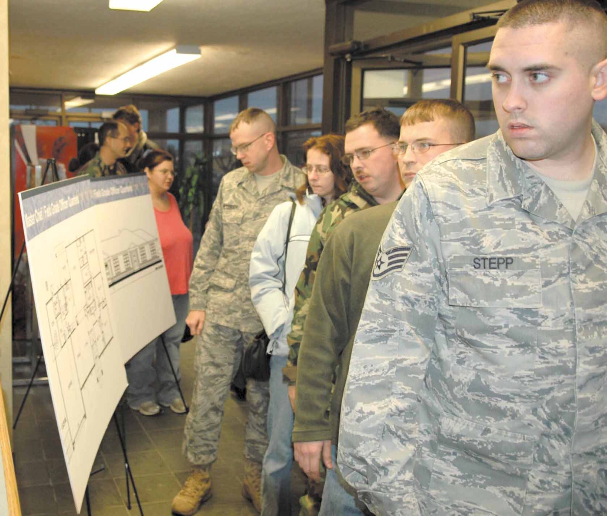 Staff Sgt. Jeffrey L. Stepp, 72nd Security Forces Squadron, is among a long line of concerned residents of Tinker base housing reviewing the posted graphics of the new housing.