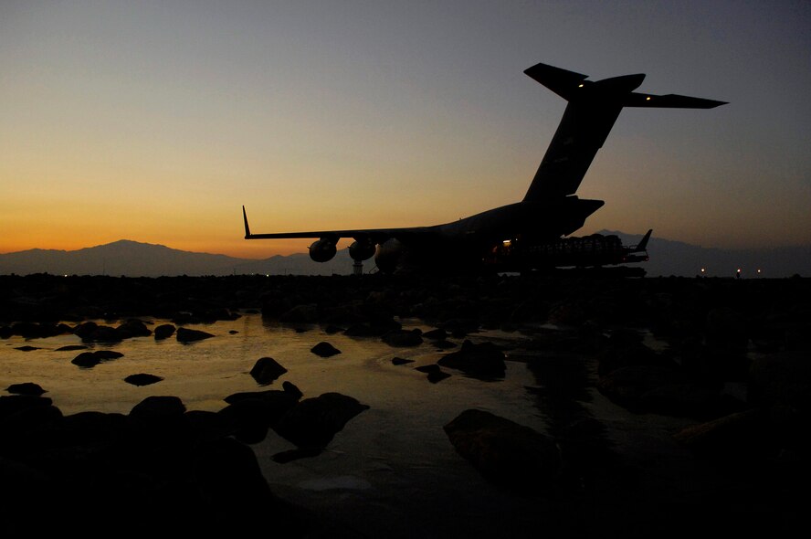 A C-17 Globemaster III is loaded with bundles for a Joint Precision Airdrop Delivery System of 40 bundles of humanitarian supplies Jan. 14 at Bagram Air Base, Afghanistan. (U.S. Air Force photo/Master Sgt. Andy Dunaway) 