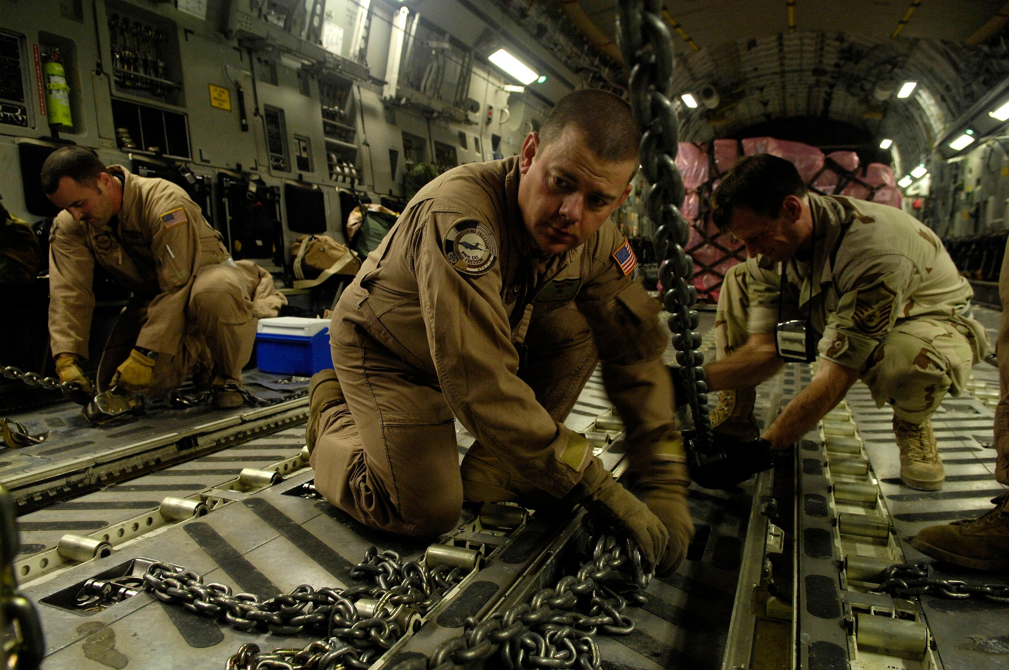 Tech. Sgt. Brad Pilgrim preflights a C-17 Globemaster III for a Joint Precision Airdrop Delivery System of 40 bundles of humanitarian supplies to a drop zone Jan. 14 in Afghanistan. Sergeant Pilgrim is a loadmaster from the 17th Airlift Squadron from Charleston Air Force Base, S.C., and is deployed to the 816th Expeditionary Airlift Squadron in Southwest Asia. (U.S. Air Force photo/Master Sgt. Andy Dunaway) 
