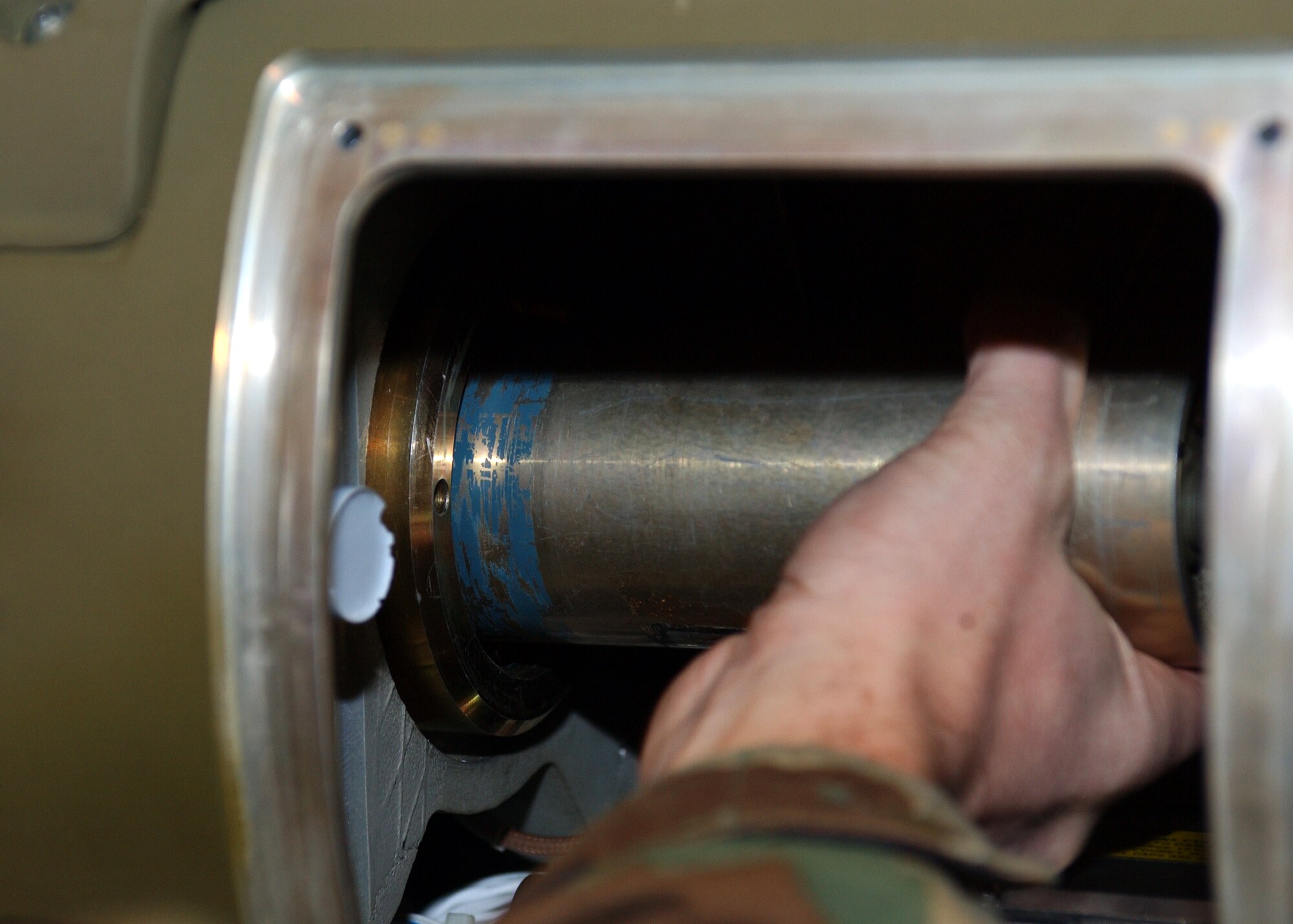 Staff Sgt. Ryan Goedde, 48th Munitions Squadron munitions systems specialist, installs the fuse, which is the starting charge for an explosive train, on an air-to-ground     munition (AGM-130) at RAF Lakenheath, England Jan. 9. The fuse is routinely replaced as necessary for weapon functionality and accuracy. (U.S. Air Force photo by Airman 1st Class Torri Ingalsbe)
