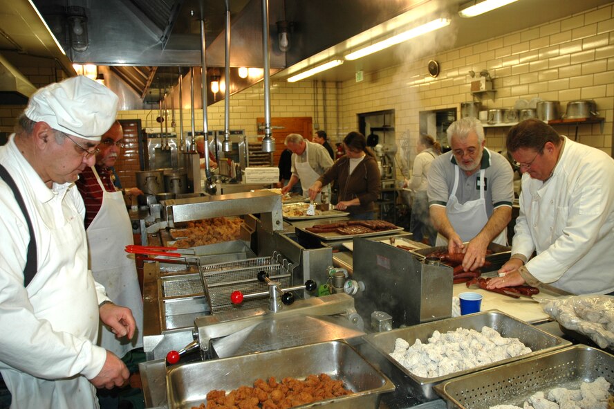MINOT AIR FORCE BASE, N.D. -- Volunteers prepare appetizers at the 43rd Annual Sportsmen's Feed at the Jimmy Doolittle Center here Jan. 13. (U.S. Air Force photo by Airman 1st Class Wesley Wright)