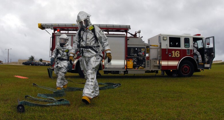 Airmen 1st Class Hector Garcia and Mark Maslowski prepare the decontamination process after a suspicious package was found at the post office during a Disease Containment Exercise Jan. 15. The exercise tests the readiness of Team Andersen in case of a future chemical or biological attack on the base. (U.S. Air Force photo/Airman 1st Class Jonathan Hart)