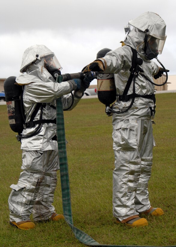 Airman 1st Class Hector Garcia performs a simulated decontamination procedure on Airman 1st Class Mark Maslowski during a Disease Containment Exercise Jan 15. Airmen Garcia and Maslowski are Fire Apprentices with the 36th Civil Engineering Squadron.  (U.S. Air Force photo/Senior Airman Sonya Padilla)