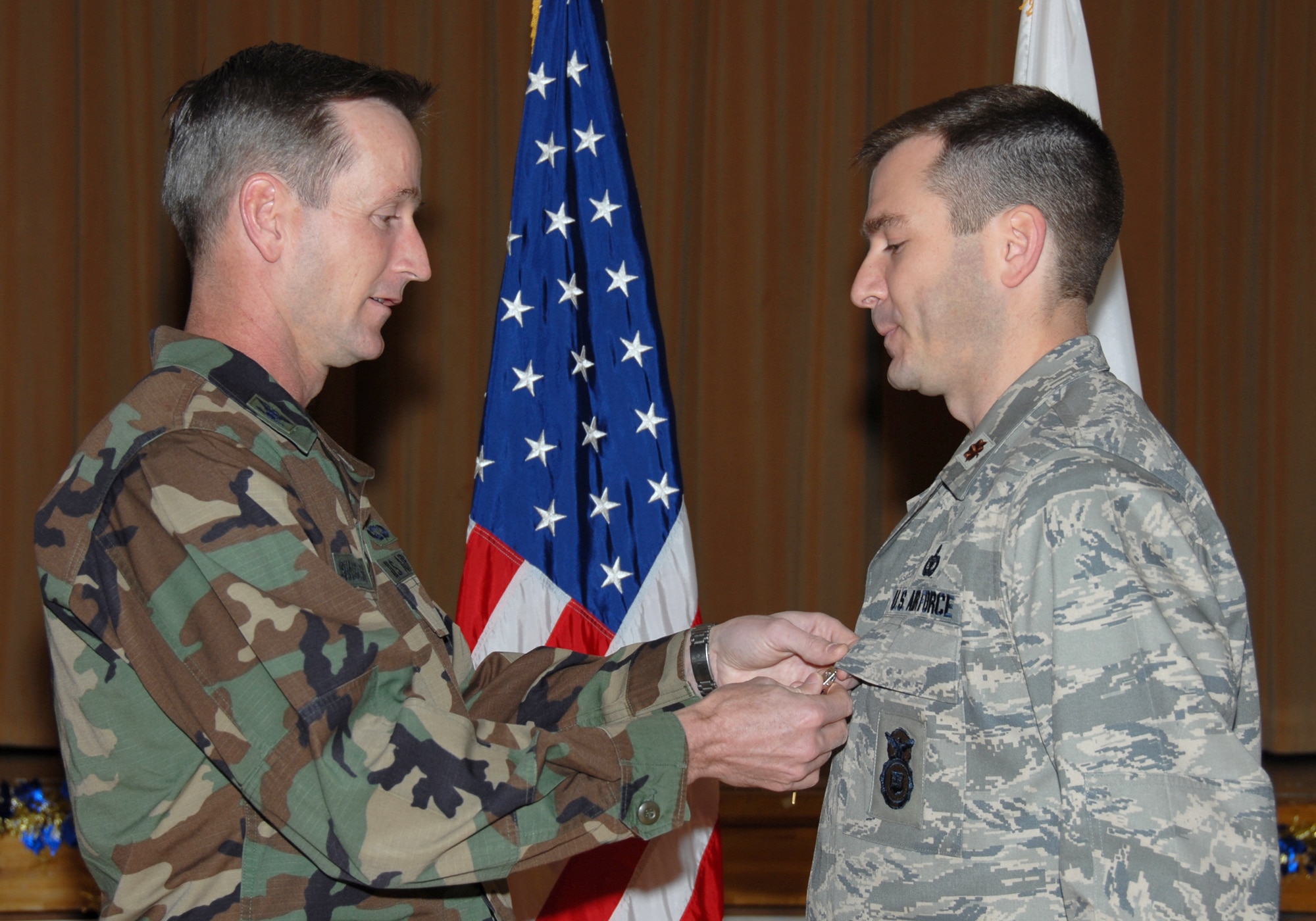 MISAWA AIR BASE, Japan -- Maj. Scott Sanford, 35th Security Forces Squadron commander, receives the Bronze Star from Col. T.J. O'Shaughnessy, 35th Fighter Wing commander, here Dec. 18, 2007.  Major Sanford received the medal for his contributions while deployed in support of Operation Enduring Freedom.  (U.S. Air Force photo by Senior Airman Laura R. McFarlane)